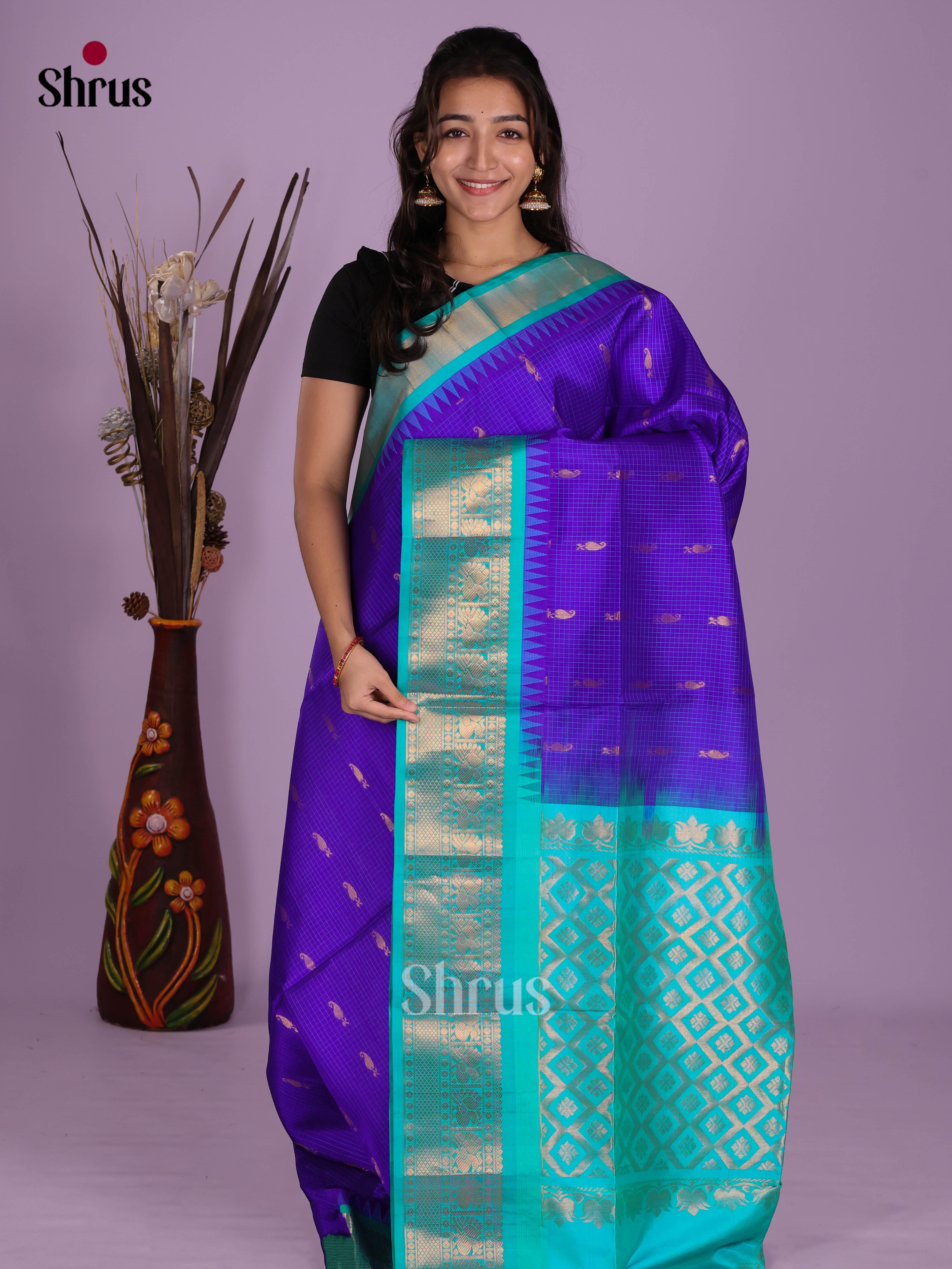 Exquisite Blue & Teal Soft Silk Saree gleams with zari buttas & traditional zari border