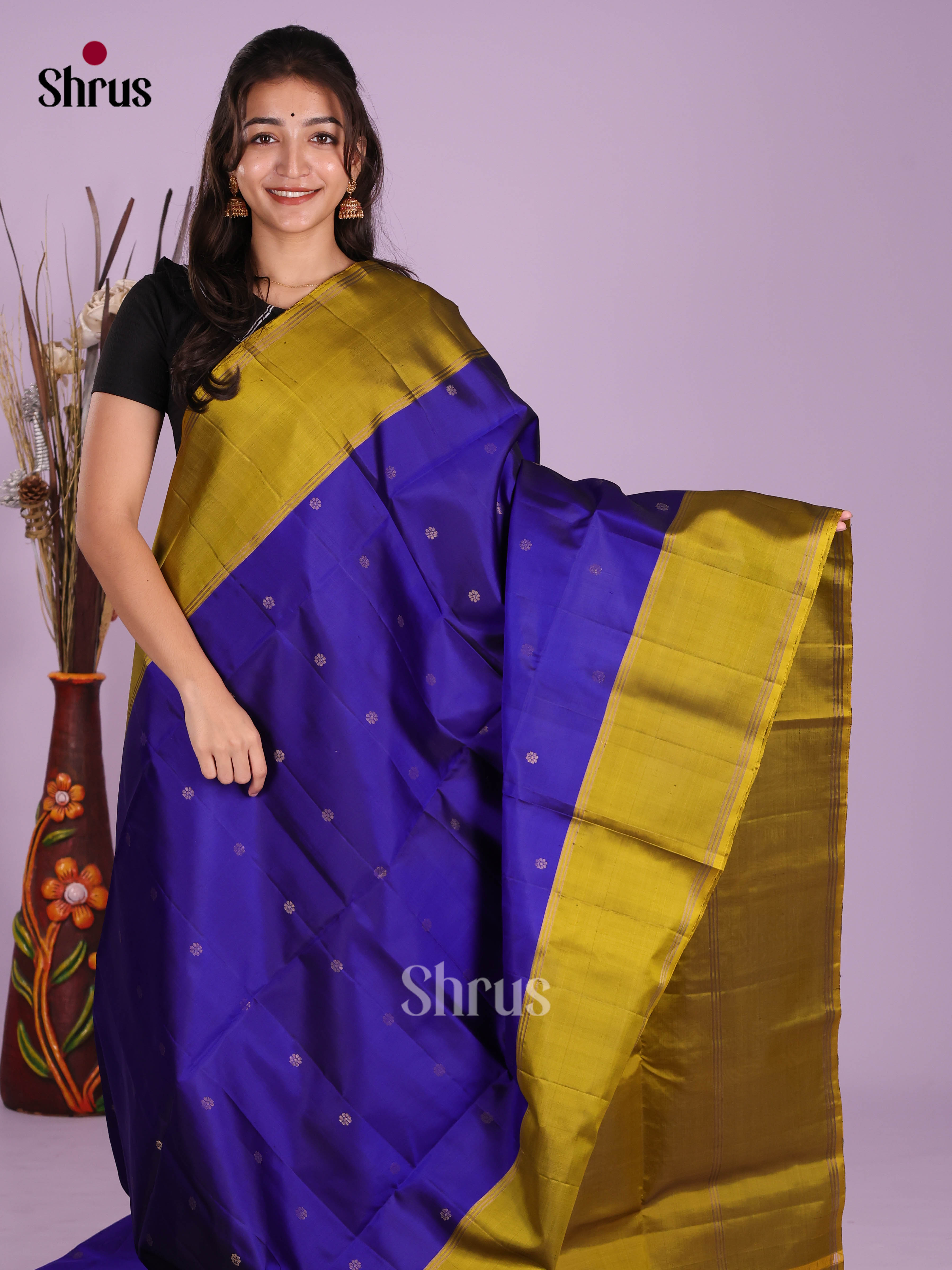Radiant Blue & Mehandi Green Soft Silk Saree dazzles with gold zari buttas