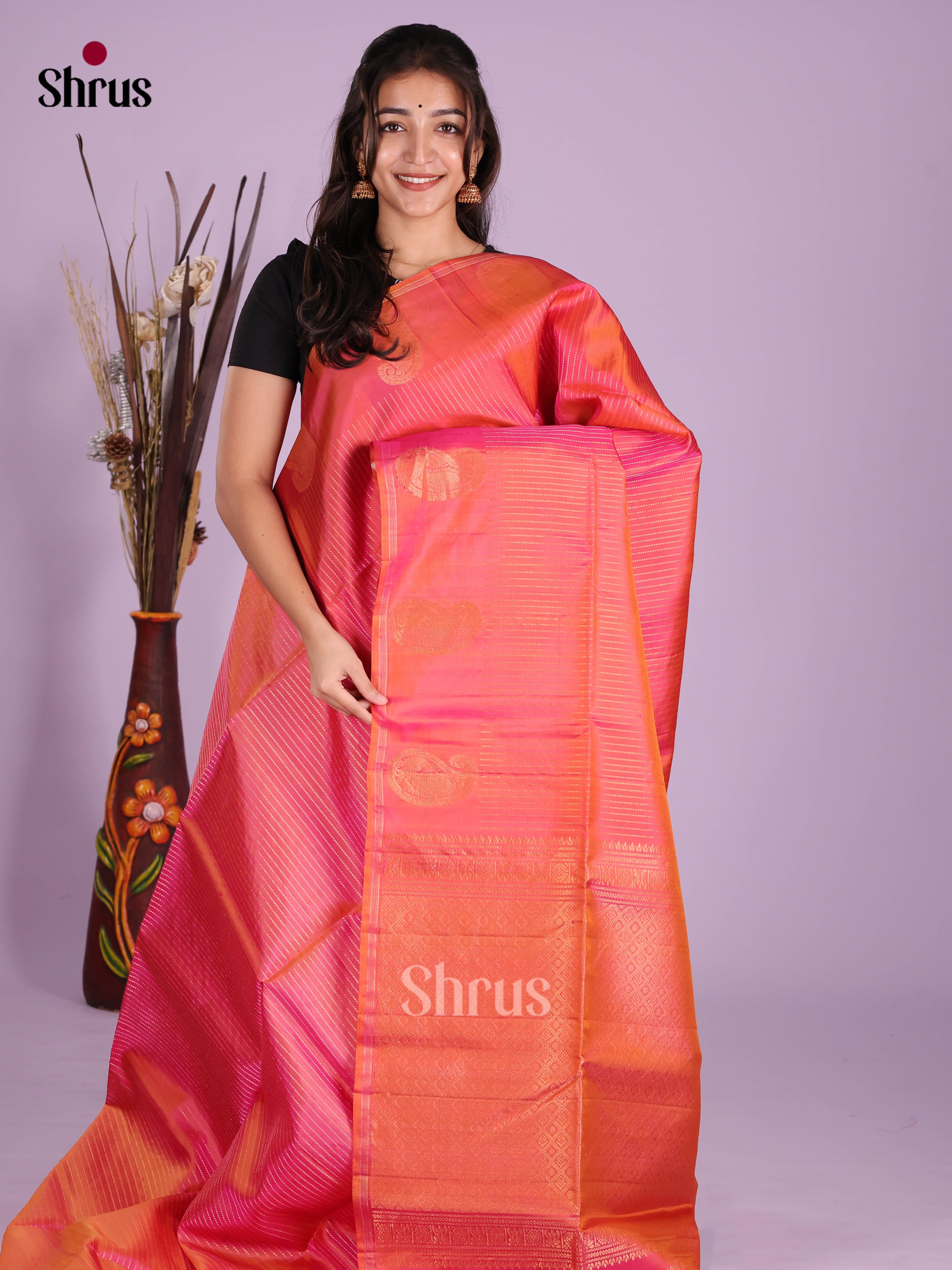 Dazzling Orangish Pink Soft Silk Saree with Zari Stripes & Paisleys Motifs Printed Border