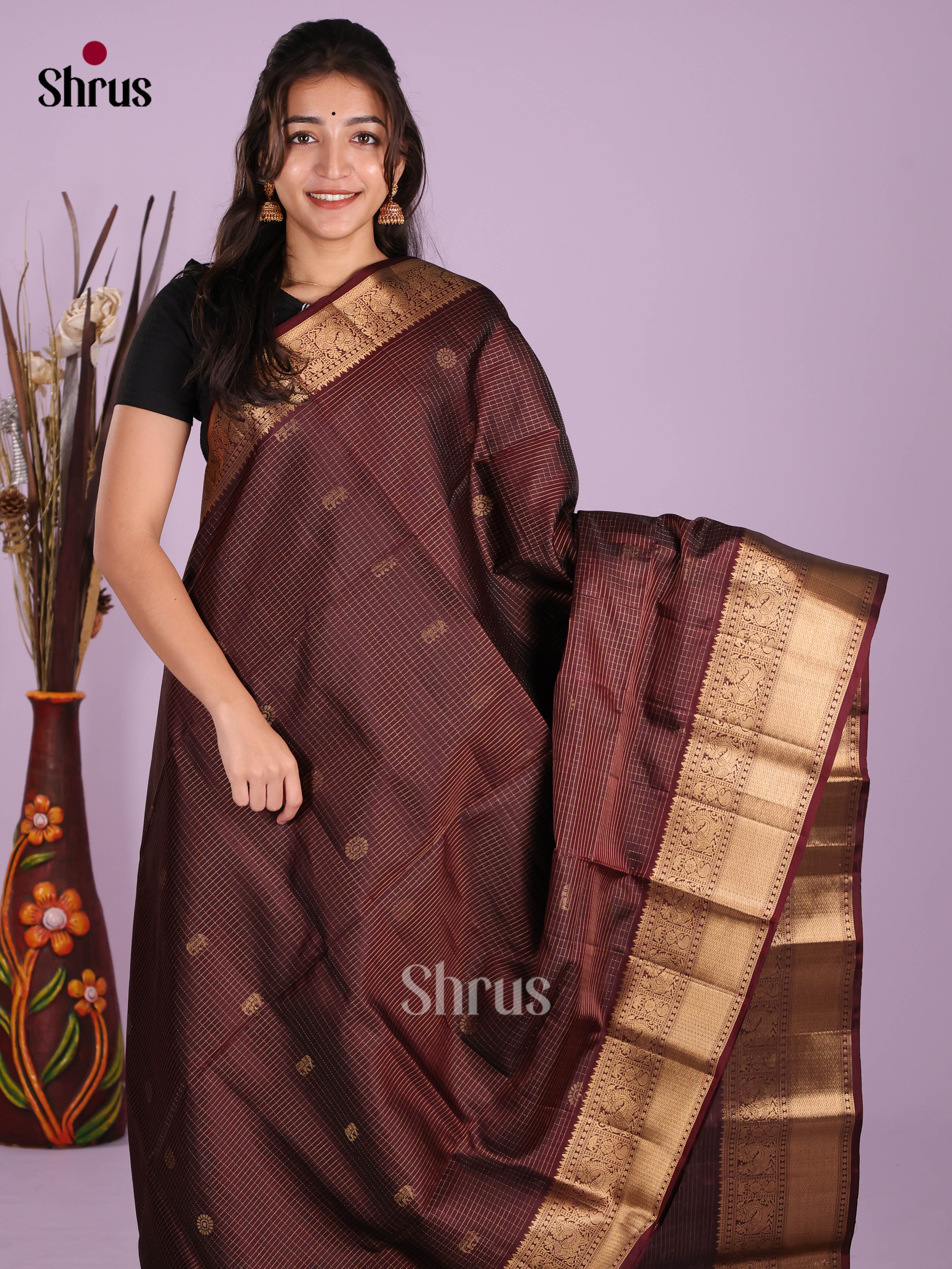 Timeless Maroon Soft Silk Saree gleams with zari checks & elephant buttas