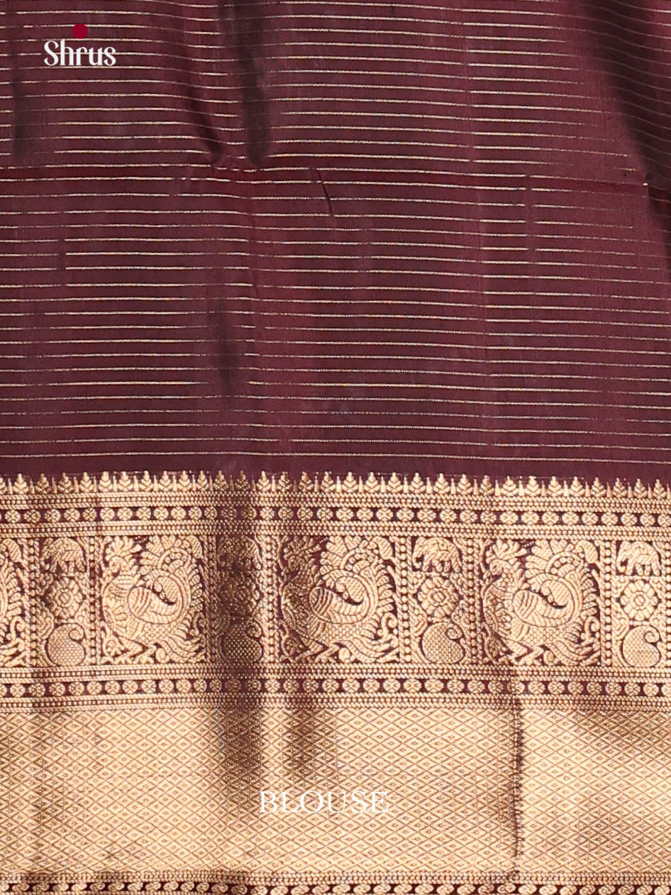 Timeless Maroon Soft Silk Saree gleams with zari checks & elephant buttas