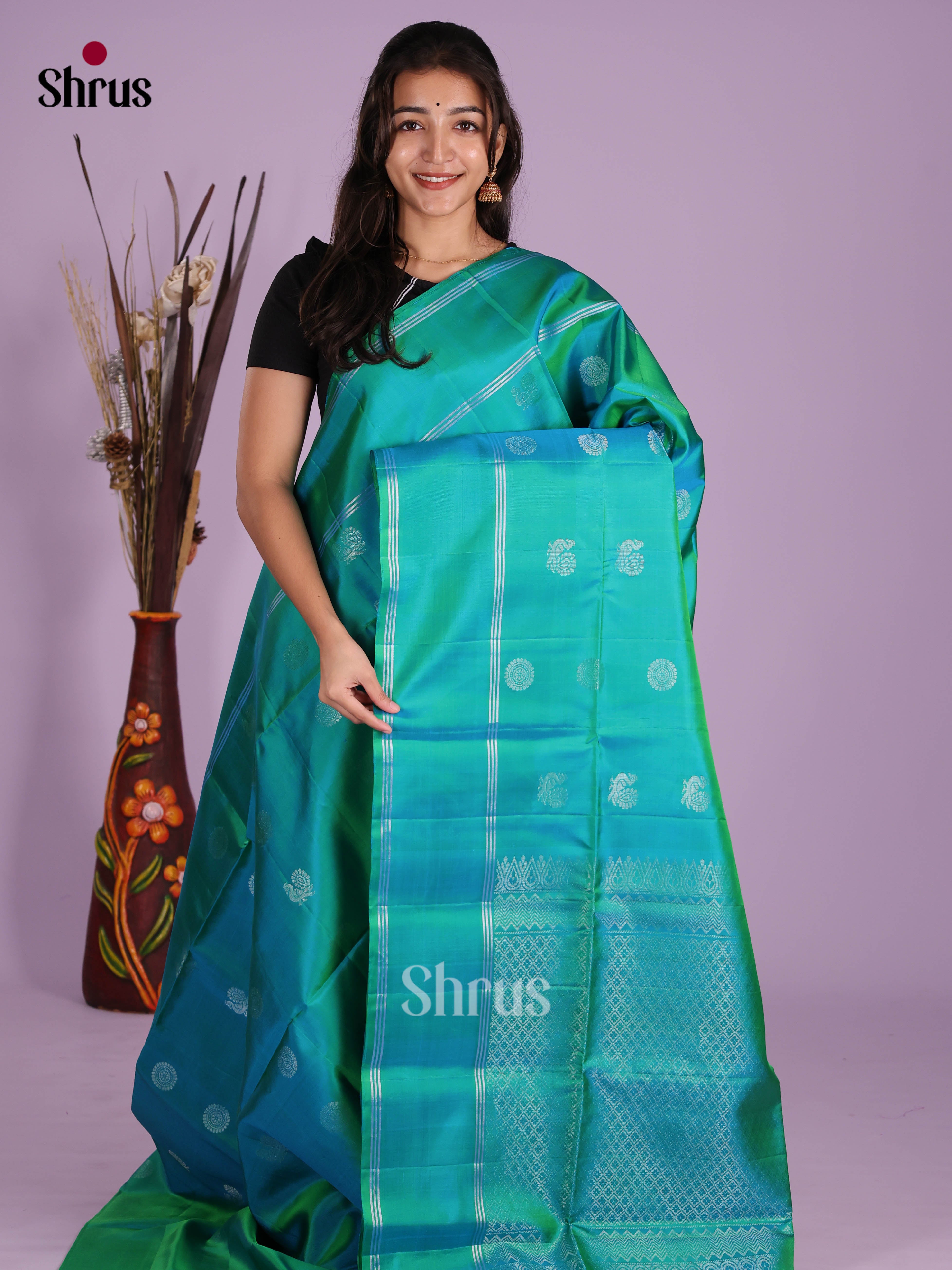 Radiant Green Soft Silk Saree with zari buttas & splendid brocade pallu