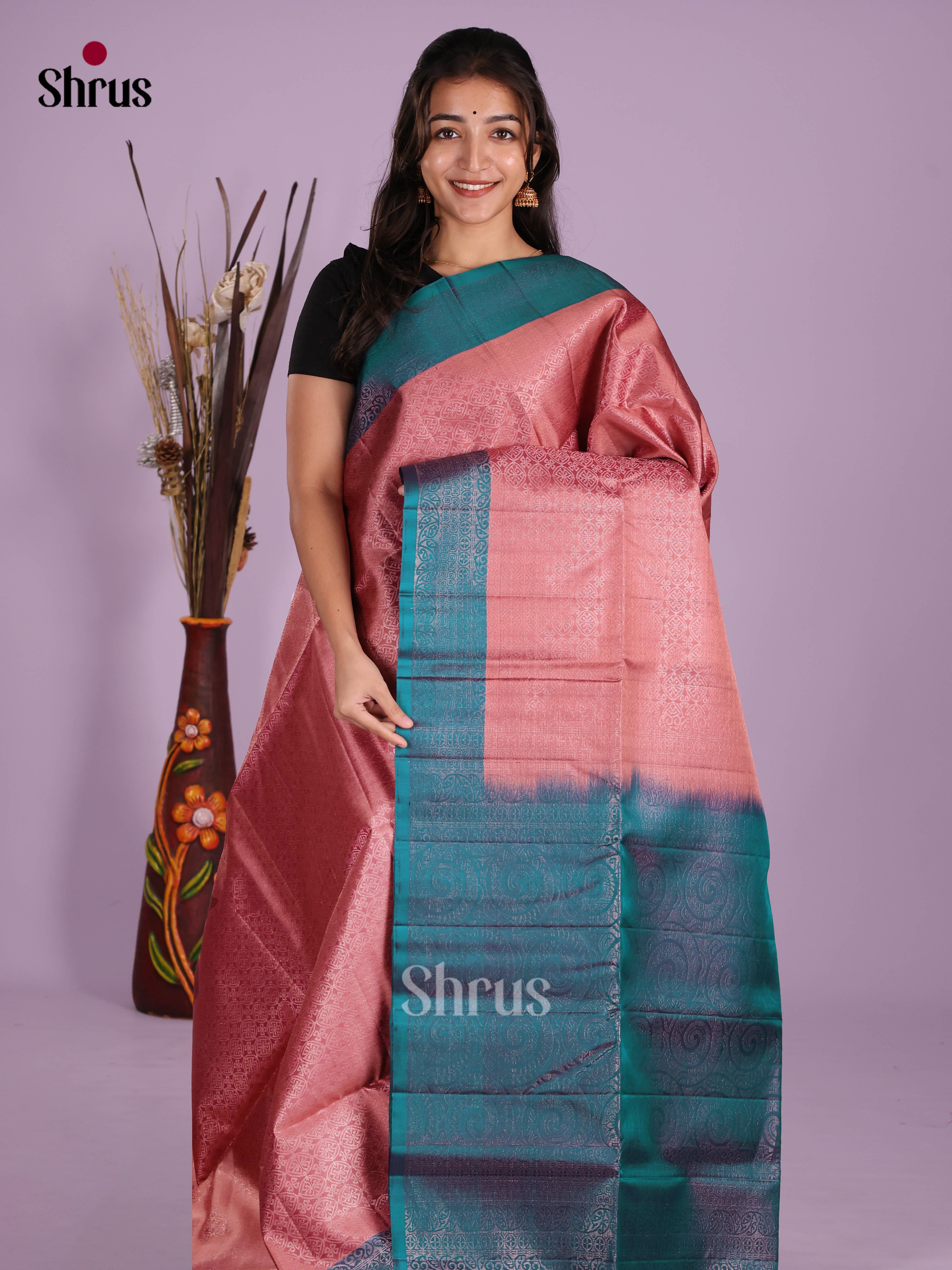 Charming Pink & Peacock Green Soft Silk Saree with zari woven floral nestling brocade