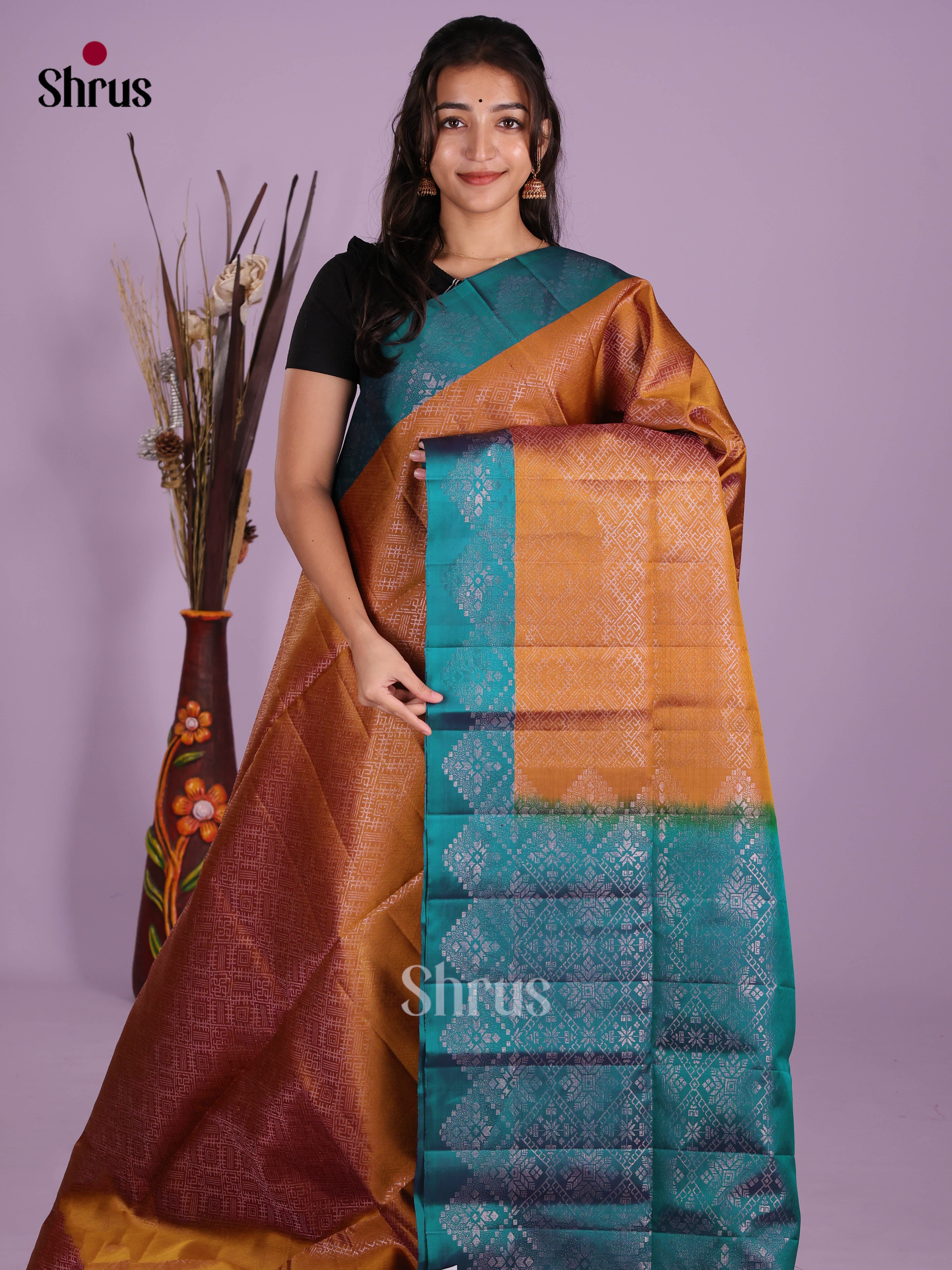 Radiant Rust Soft Silk Saree with zari woven floral nestling brocade