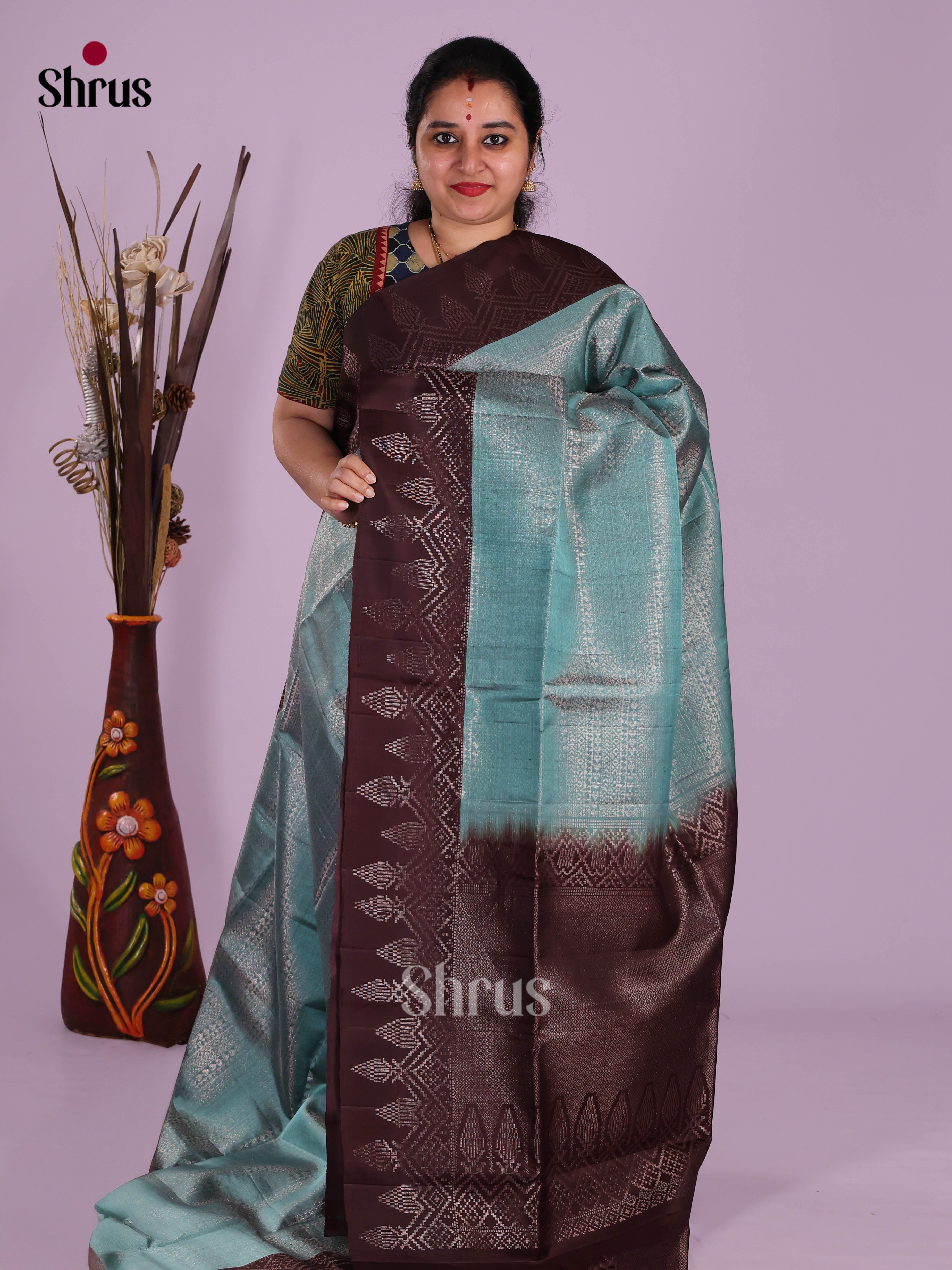 Vibrant Teal Blue Soft Silk Saree with zari brocade body & brown border
