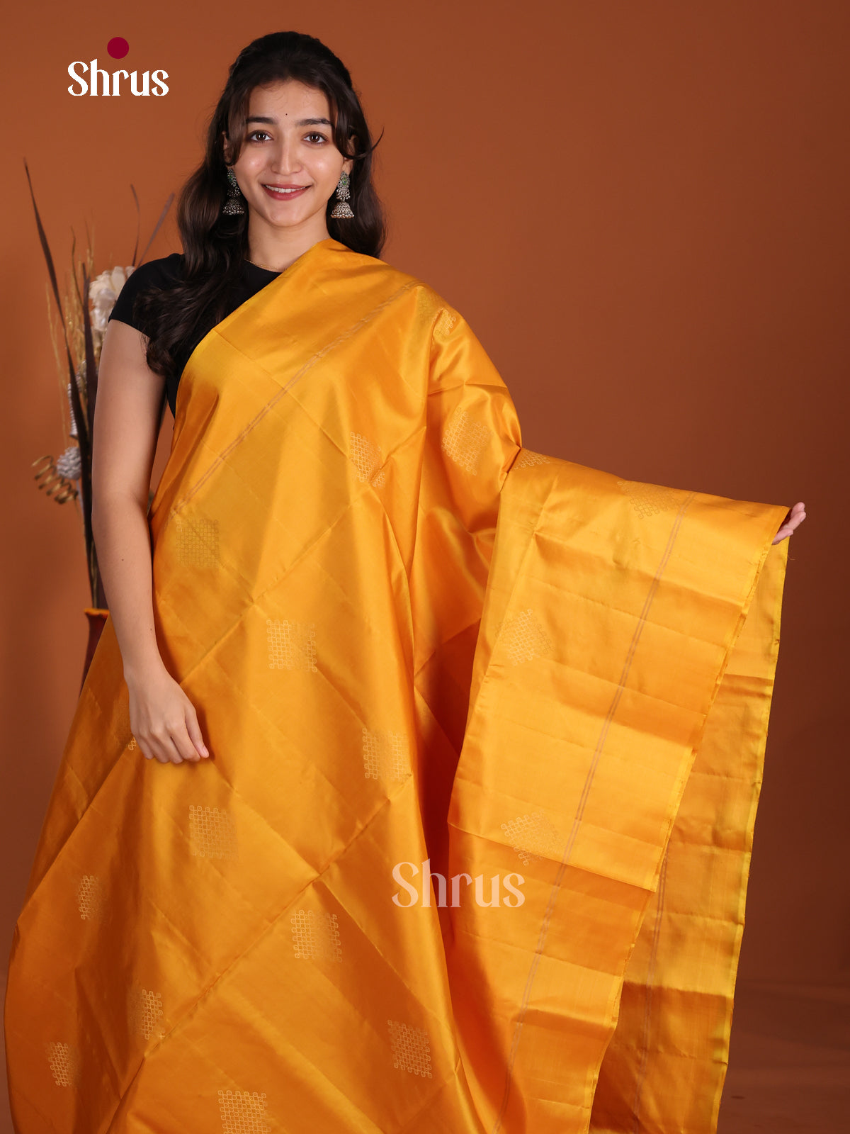 Lustrous Mustard single tone Soft Silk Saree with zari kolam motifs