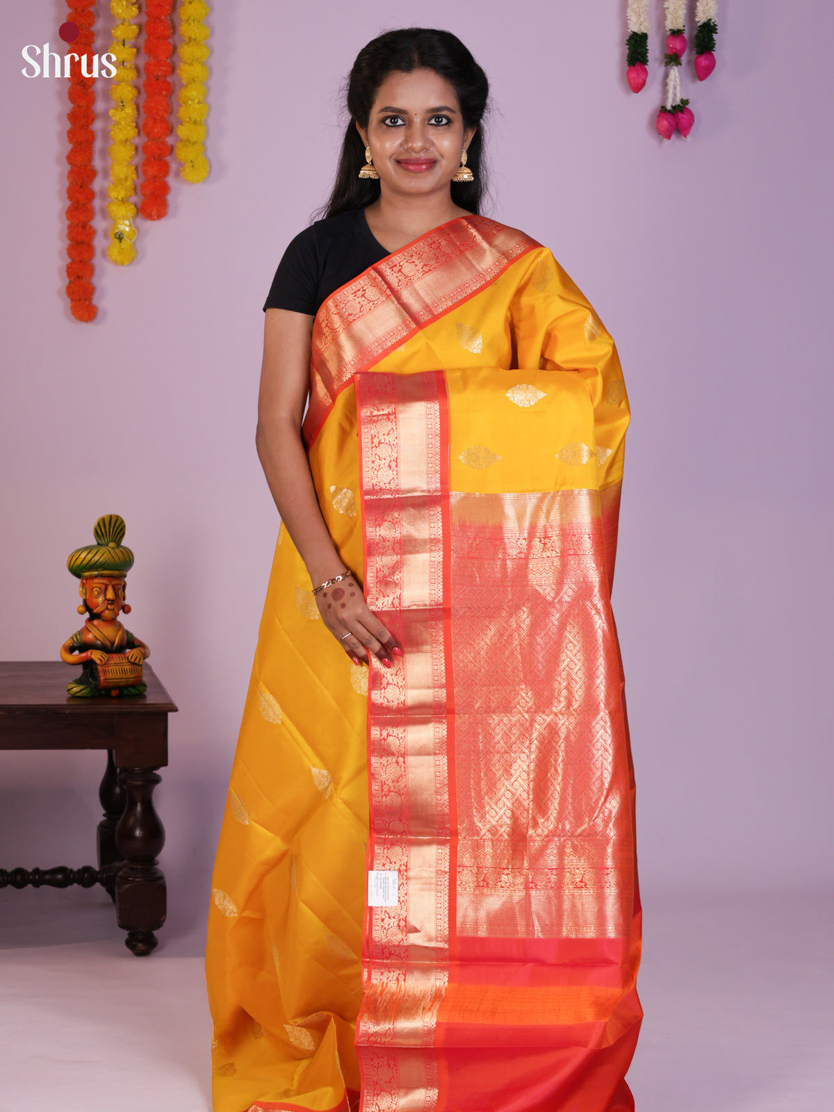 Lustrous Yellow Kanjivaram Saree With Golden Buttas & Red Zari Border
