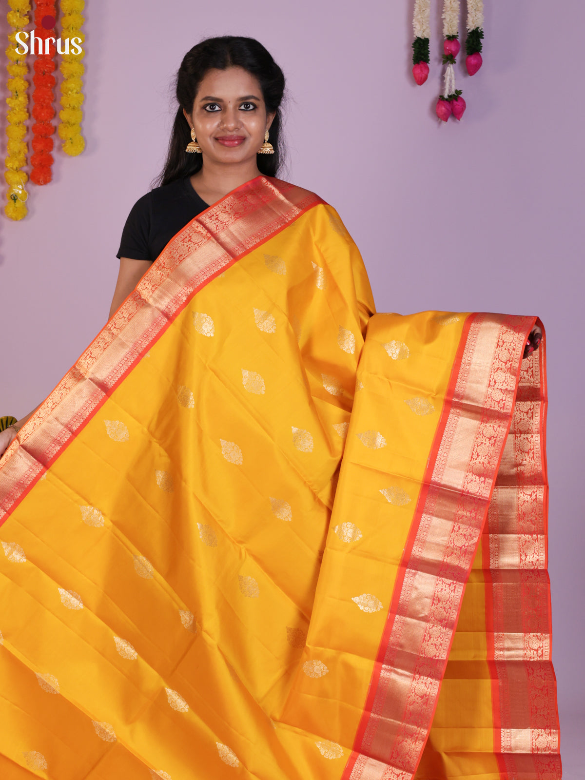 Lustrous Yellow Kanchipuram Saree With Golden Buttas & Red Zari Border