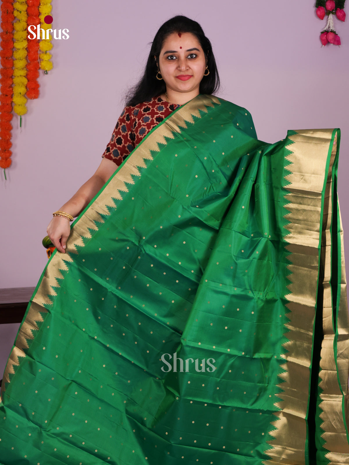 Serene Green Kanjivaram Saree With Small Buttas & Zari Woven Temple Border