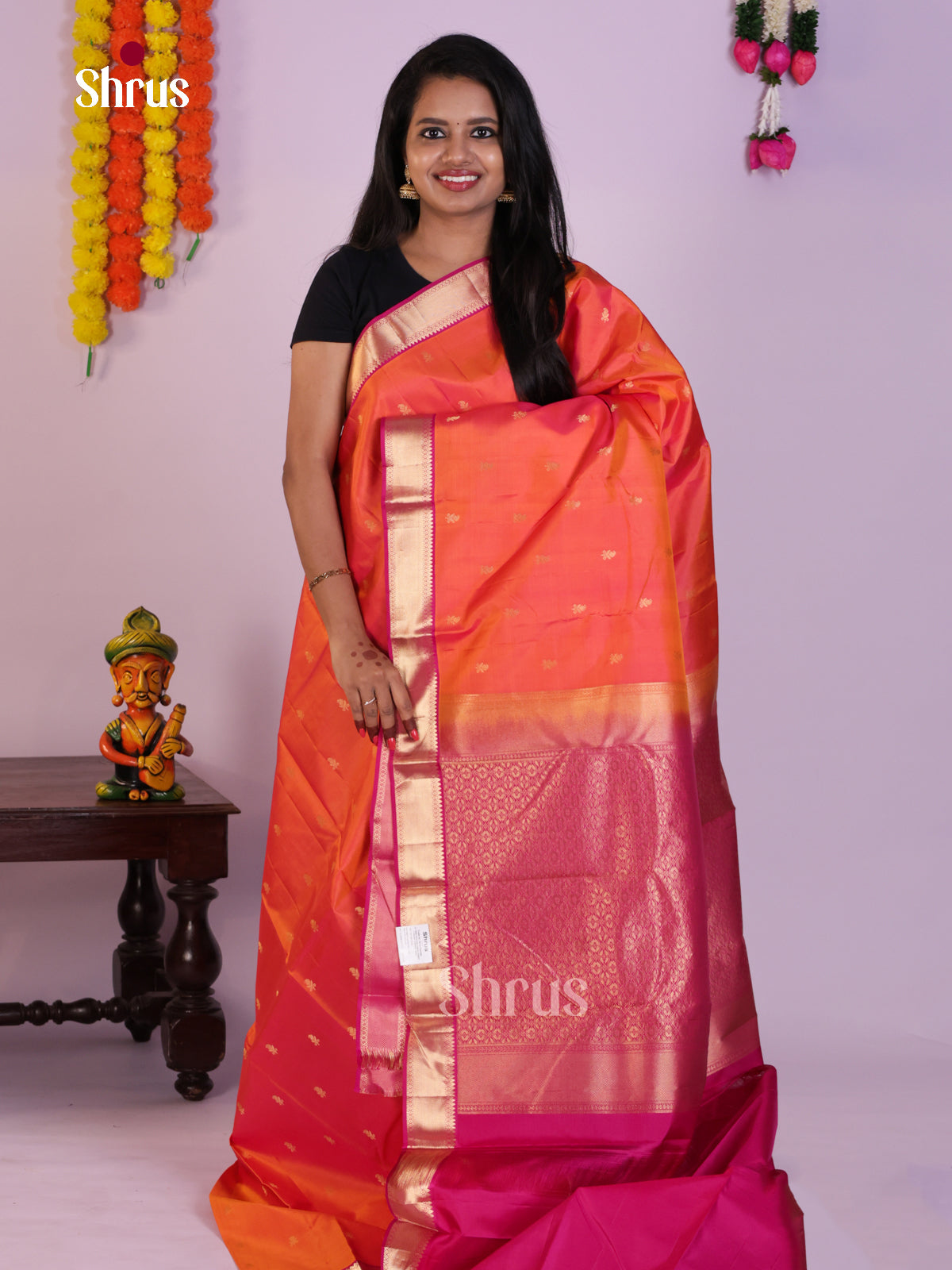 Radiant Orange Kanchipuram Saree with Zari Buttas & Purple Brocade Pallu