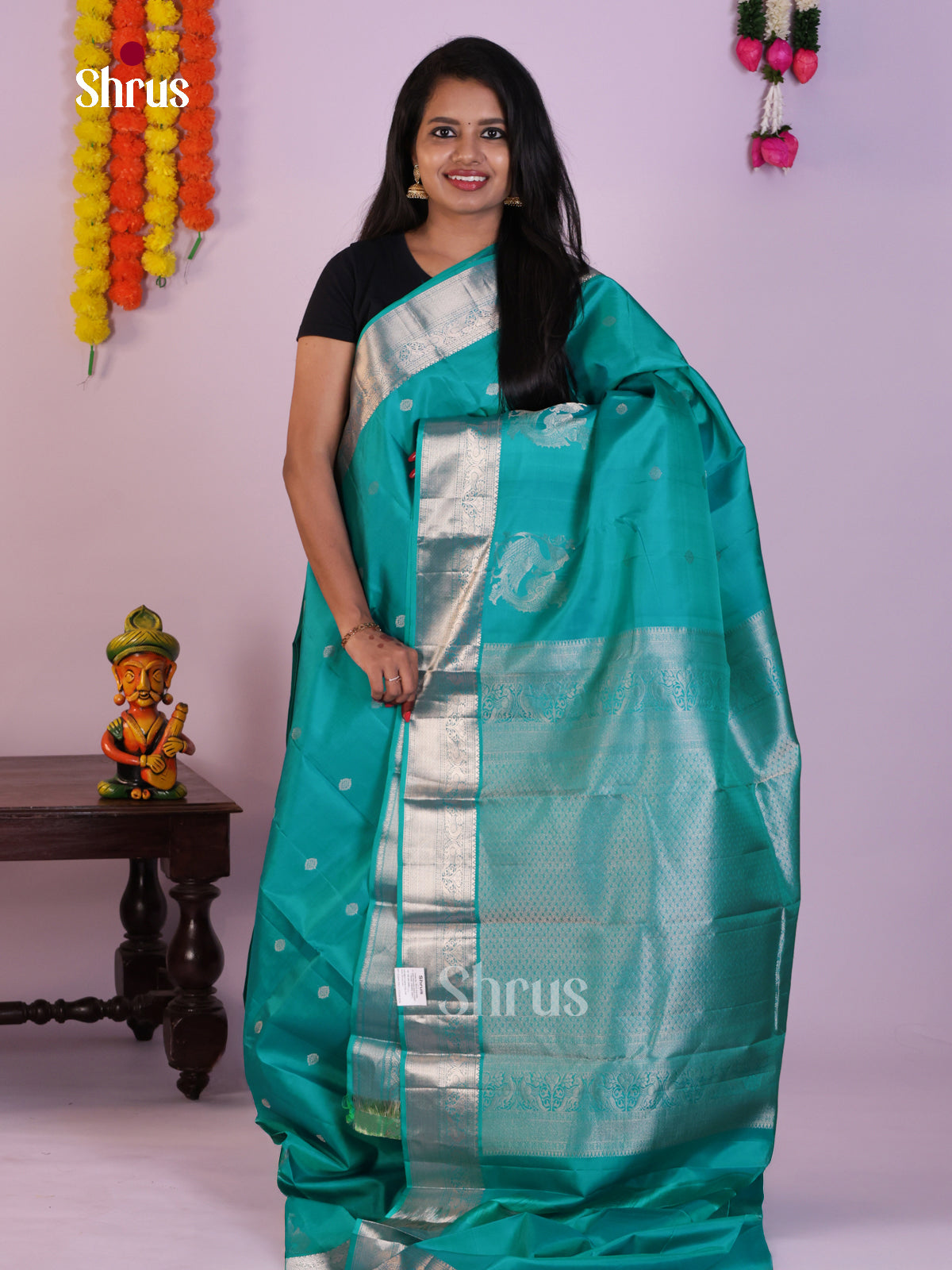 Teal Kanjivaram Saree with Silver Zari Buttas & Brocade Pallu