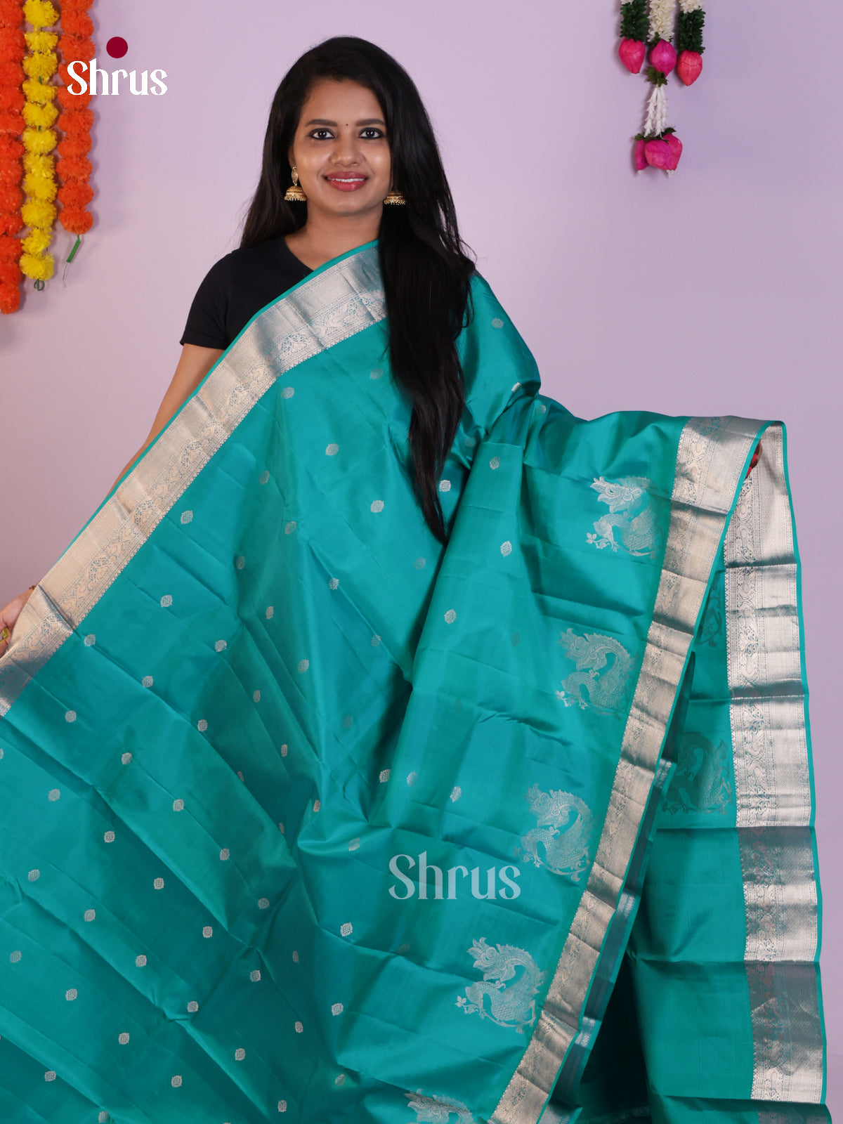 Teal Kanchipuram Saree with Silver Zari Buttas & Brocade Pallu