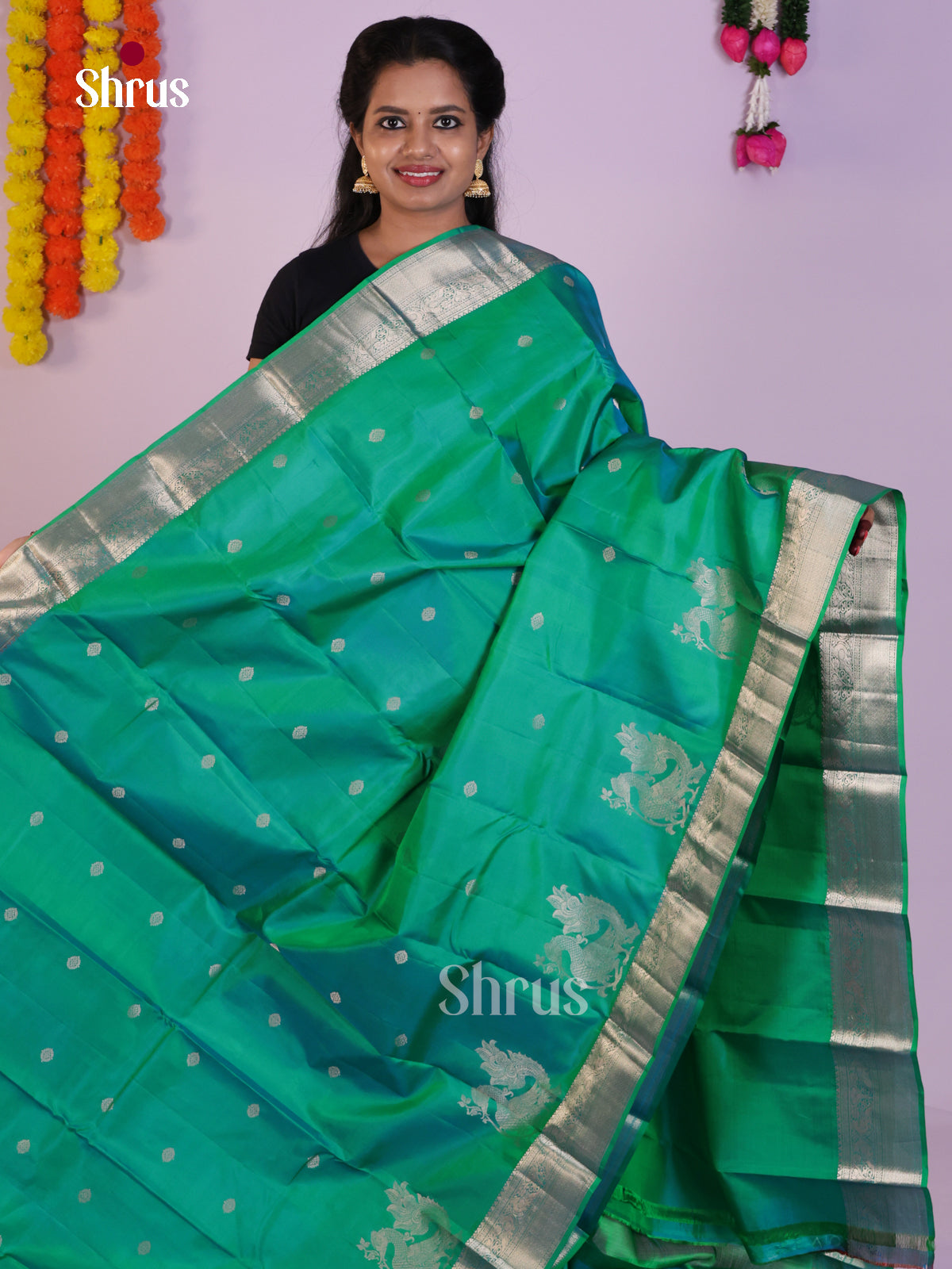 Graceful Green Kanchipuram Saree with Silver Zari Buttas & Brocade Pallu