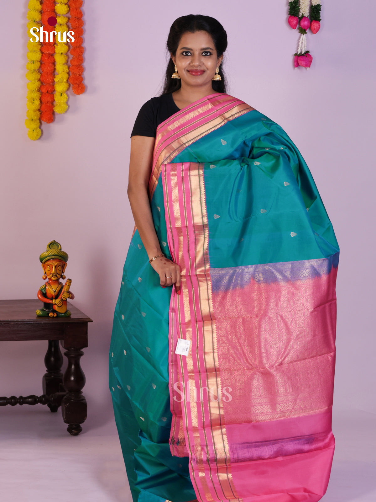 Stunning Teal Blue Kanjivaram Saree With Leaf Buttas & Light Pink Rettaipet Zari Border