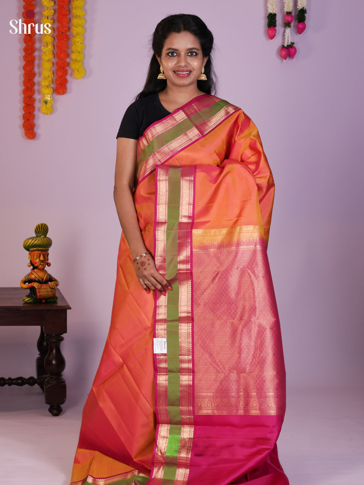 Lustrous Orange Kanchipuram Pattu Saree With Pink Rettaipet Zari Border
