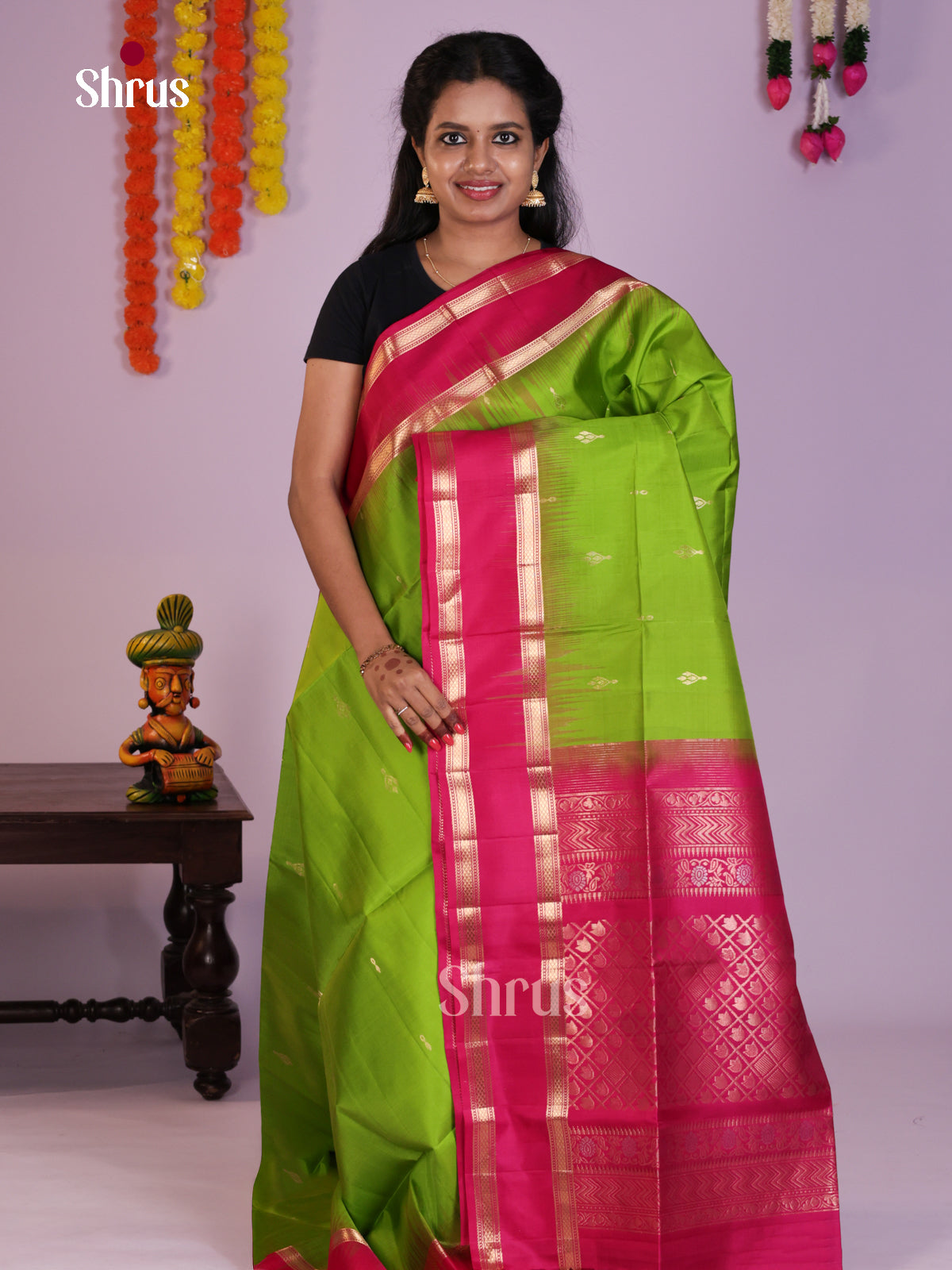 Beautifully Chic Parrot Green Soft Silk Saree gleams with zari floral buttas & Rettaipet Border