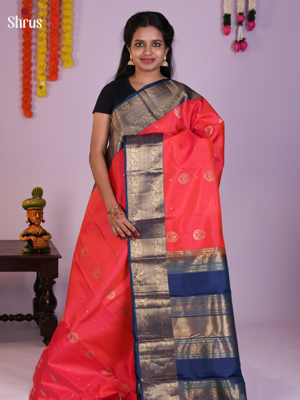 Timeless Peach Kanchipuram Silk Saree With Navy Blue Zari Border