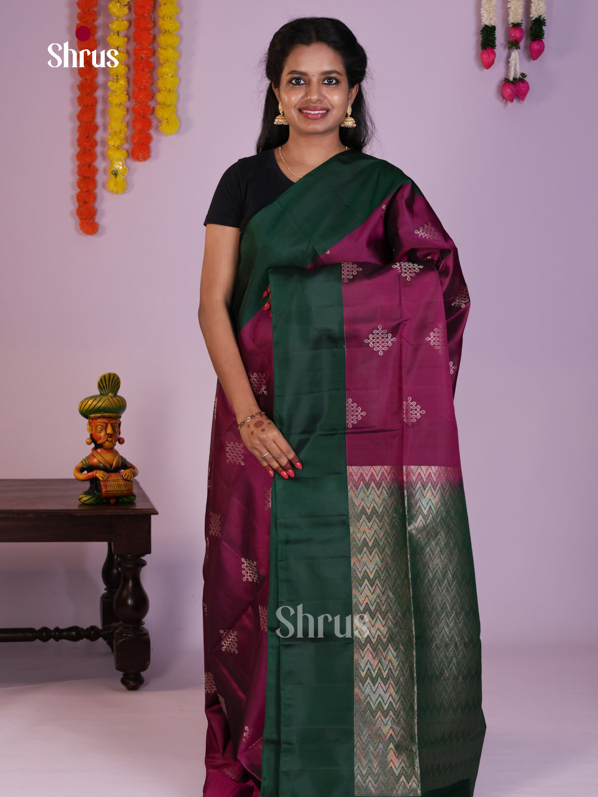Timeless Wine & Green Soft Silk Saree gleams with zari kolam buttas