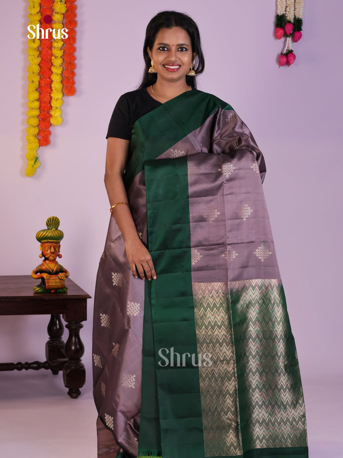Vivacious Lilac & Green Soft Silk Saree gleams with zari kolam motifs
