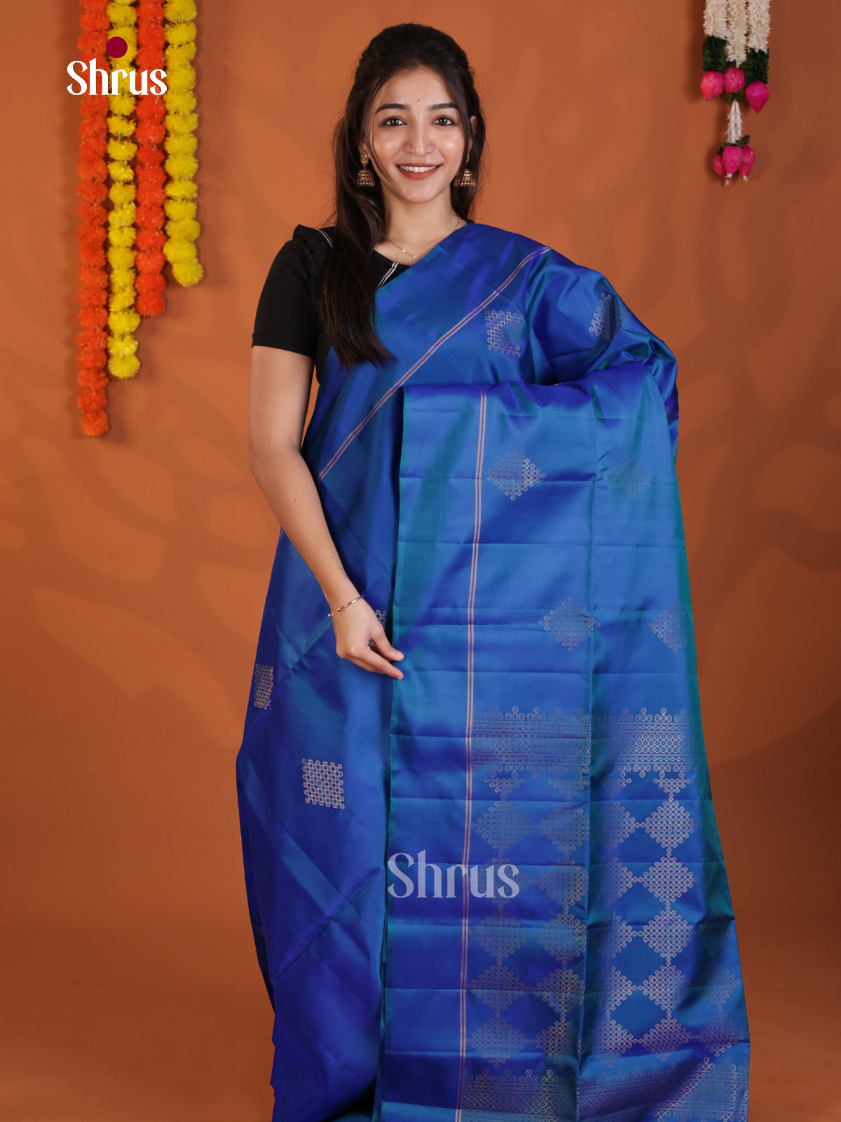 Vibrant Blue Soft Silk Saree gleams with zari kolam buttas - Shop on Shrus.com
