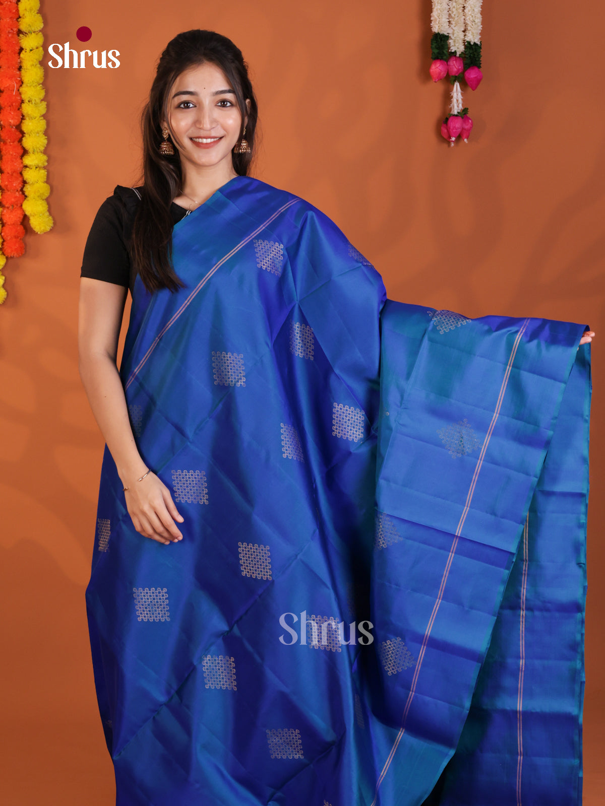Vibrant Blue Soft Silk Saree gleams with zari kolam buttas - Shop on Shrus.com