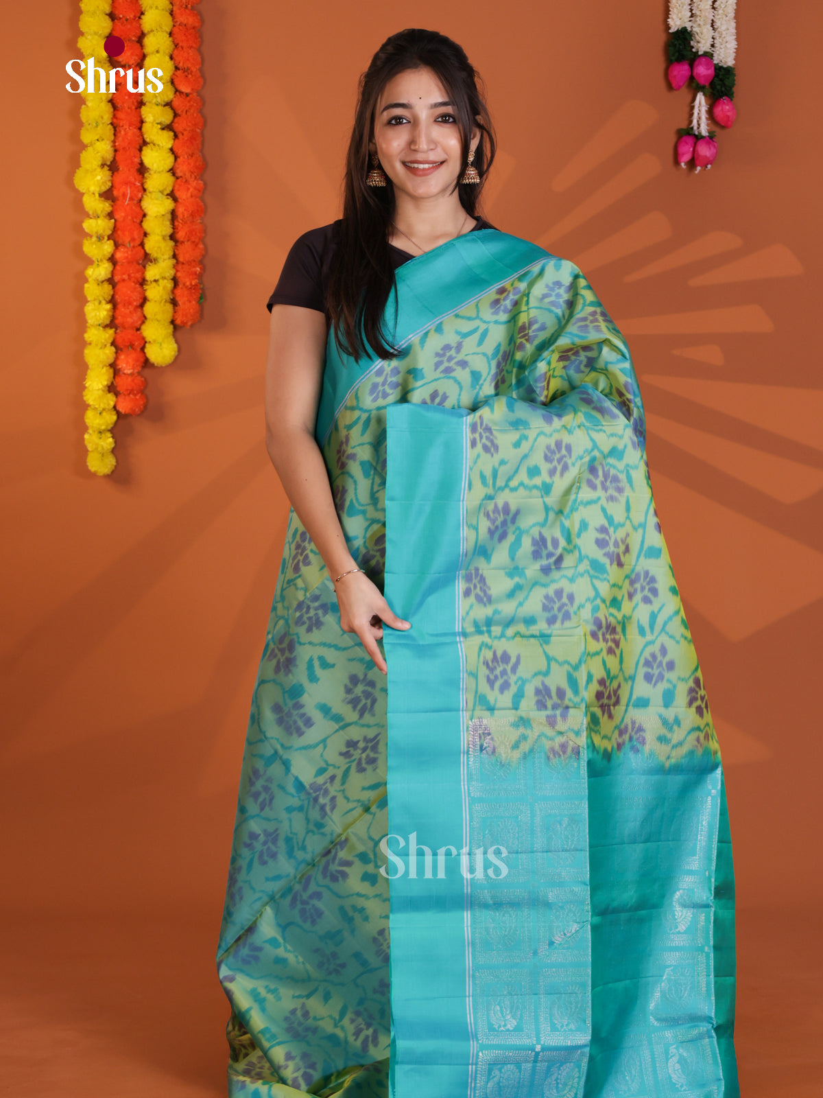 Charming Green & Blue Soft Silk Saree with ikkat floral pattern & brocade pallu