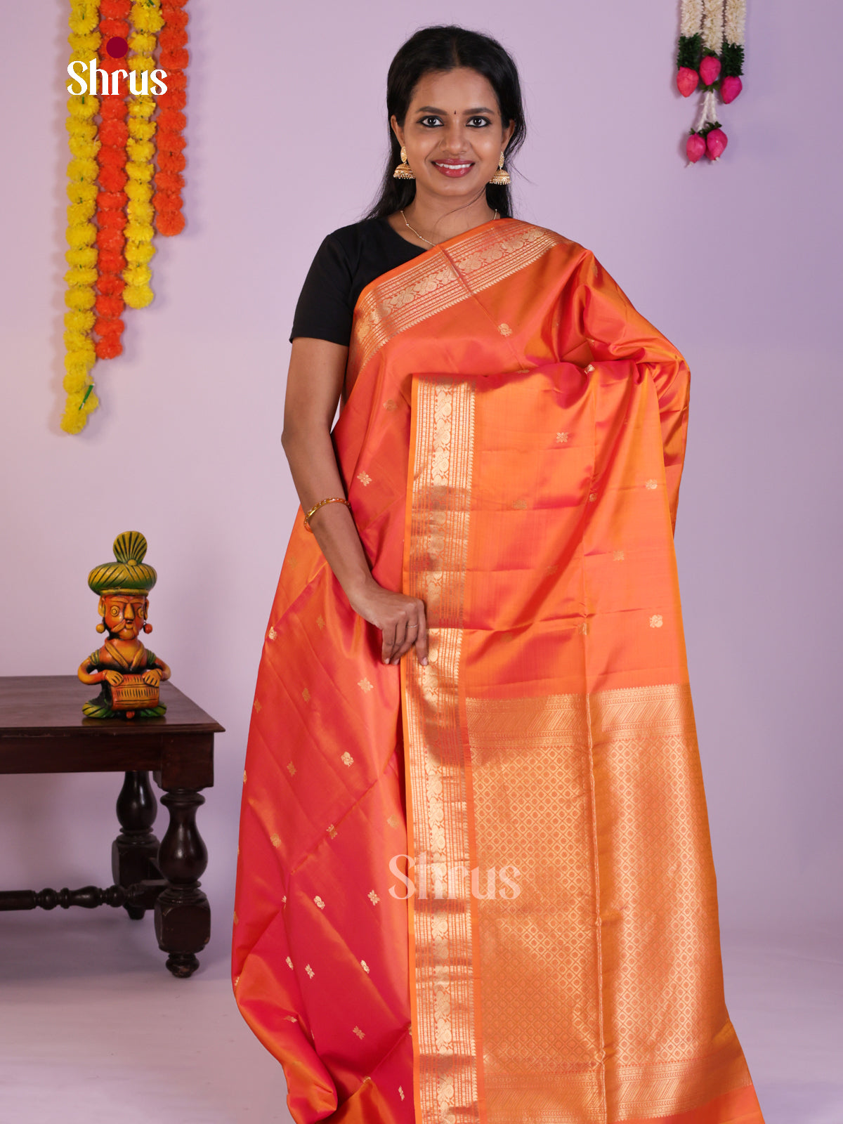 Radiant Orange Soft Silk Saree with zari peacock buttas & brocade pallu