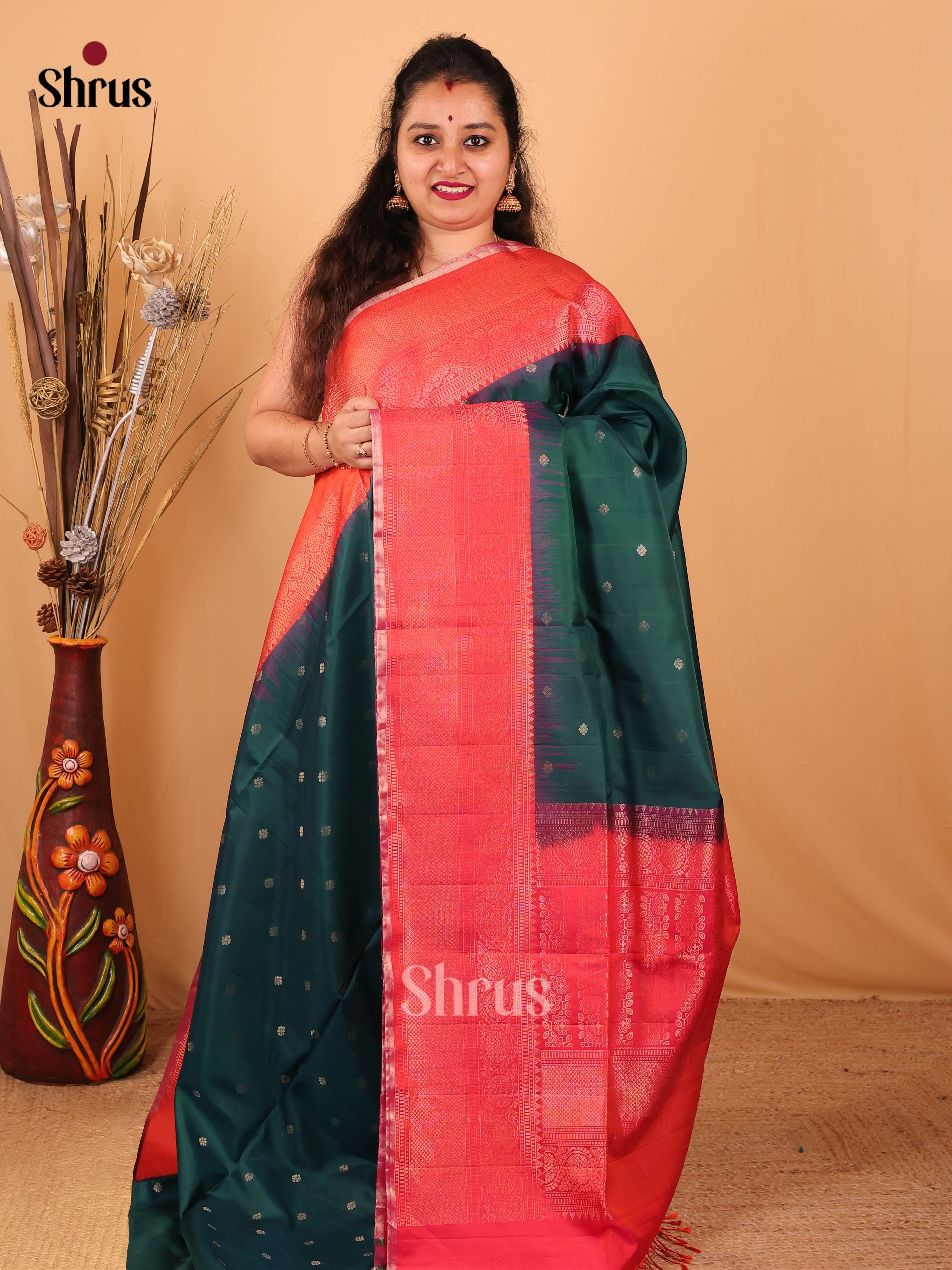 Classy Deep Green Soft Silk Saree With Zari Buttas, Orangish Pink Border & Pallu