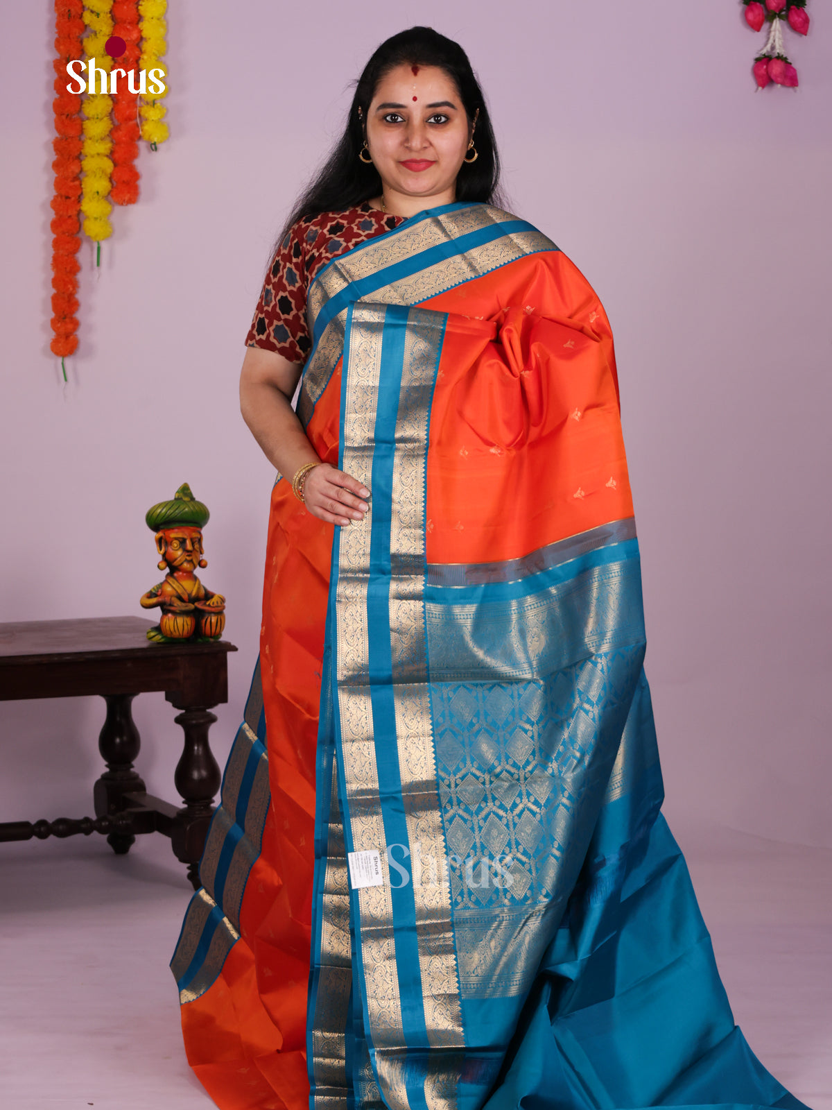 Striking Orange Kanjivaram Saree With Zari Buttas & Blue Rettaipet Border