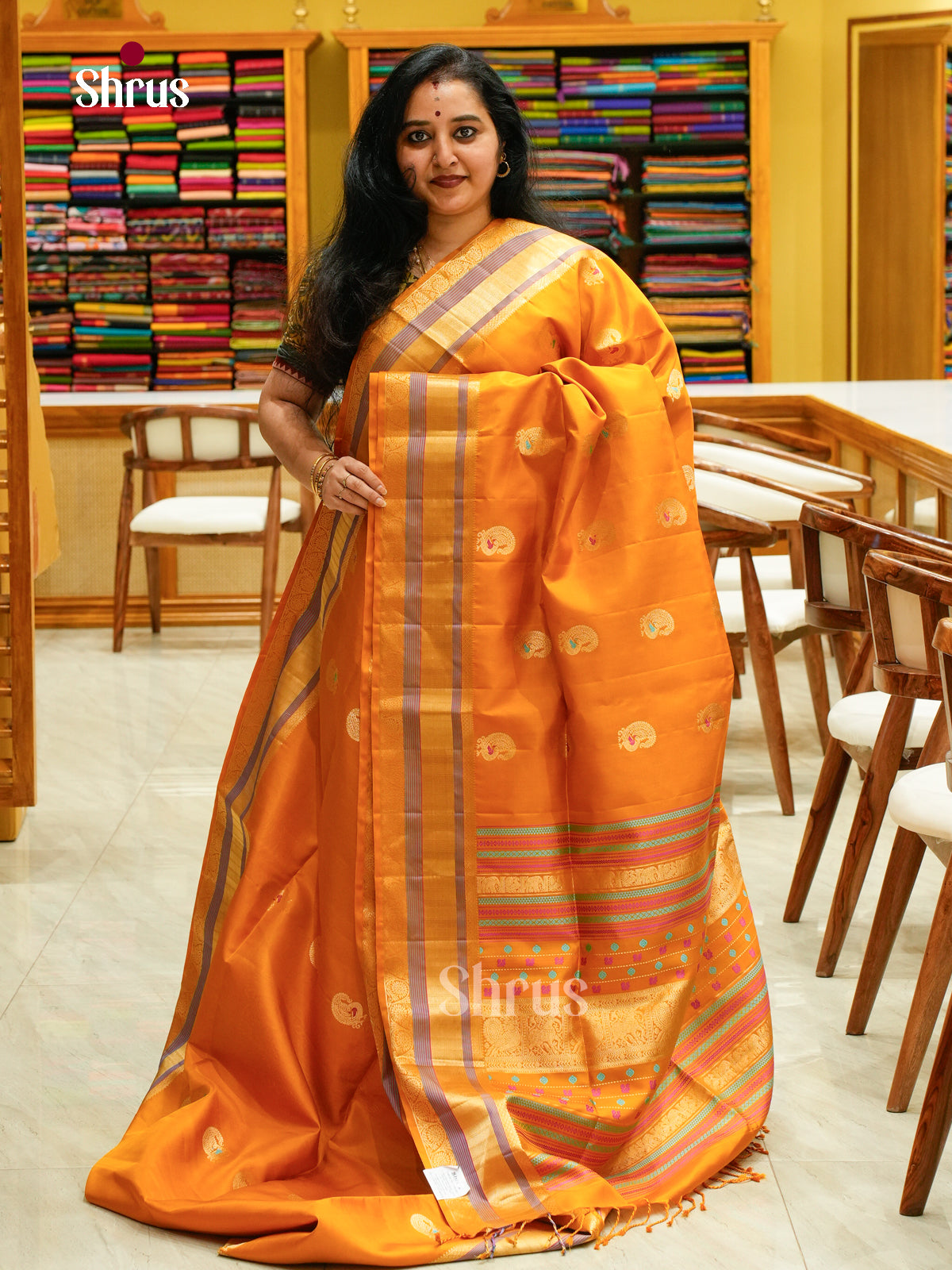 Mustard Soft Silk Saree with Peacock Buttas