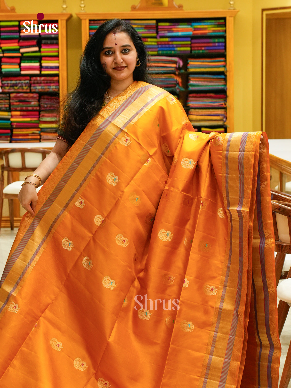 Mustard Soft Silk Saree with Peacock Buttas