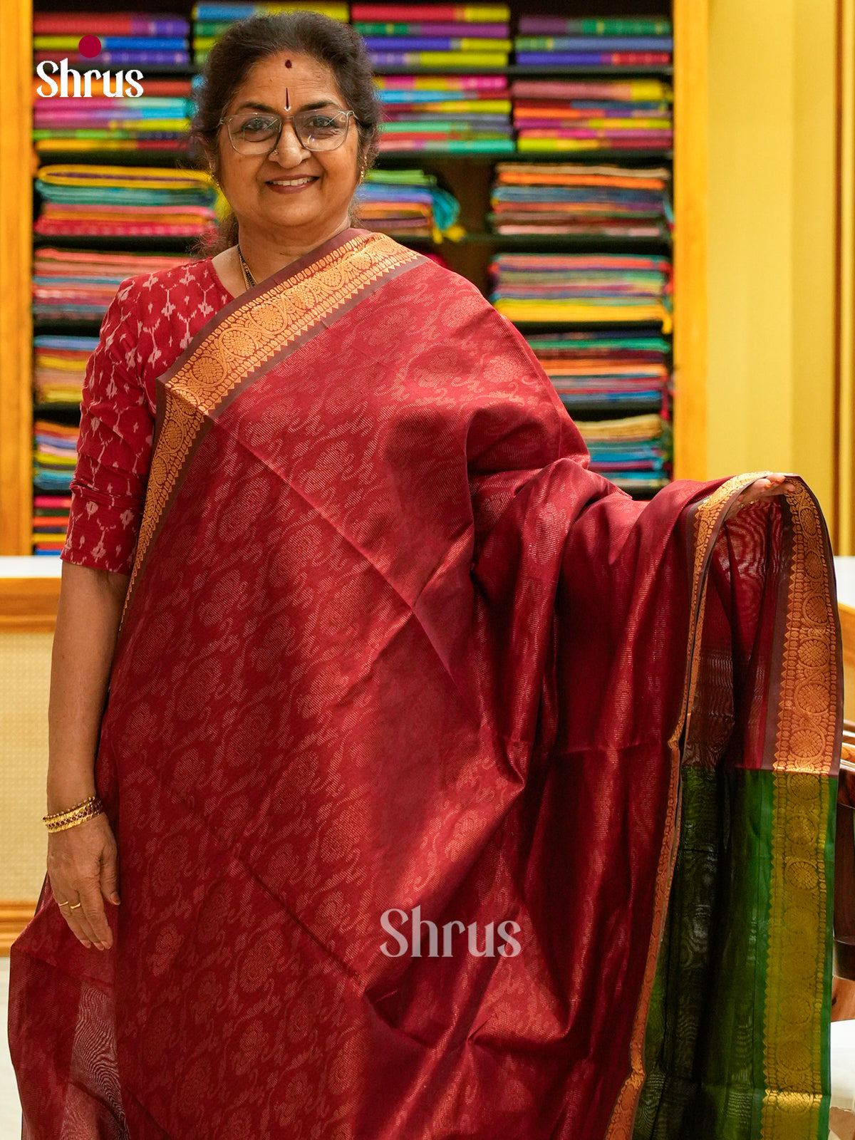 Maroon Silk Cotton Saree with Brocade and Floral Nestling Brocade | Dark Green Contrast Border