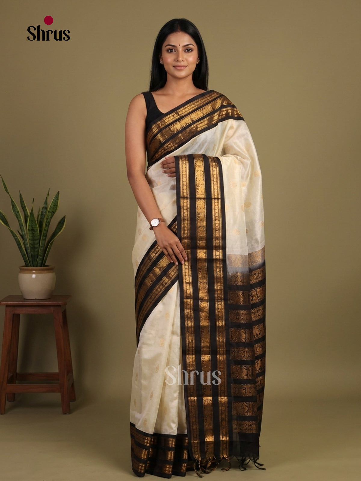Charming Cream & Black Silk Cotton Saree with zari floral buttas & striped Pallu