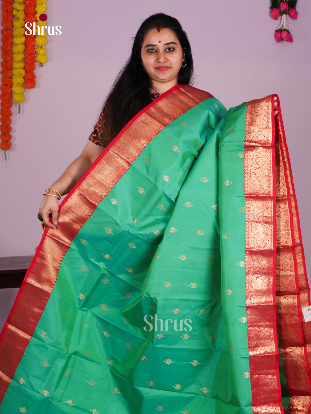 Buy Serene Green Kanchipuram Saree with Golden Floral Buttas, Red Zari Border & Brocade Pallu