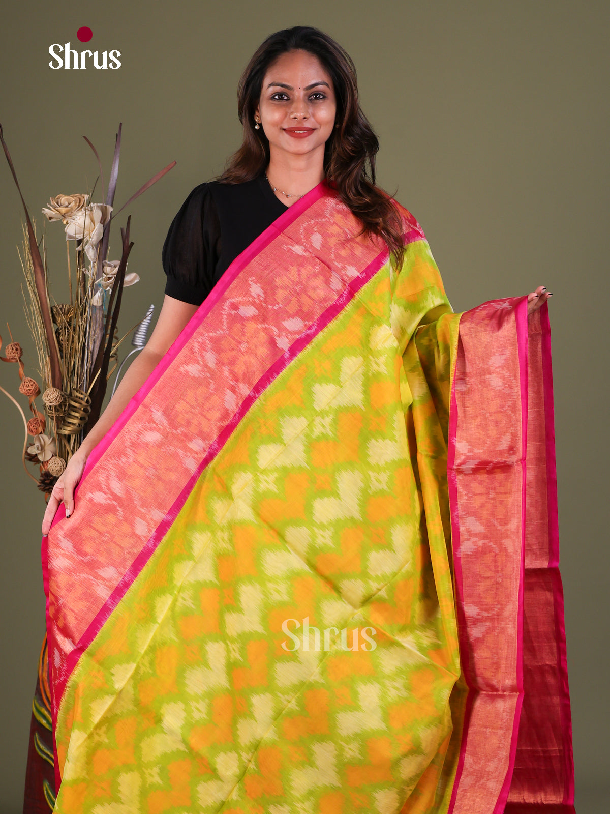 Luminous Mustard Green Pochampally Cotton Silk Saree With Ikat Prints & Pink Floral Border