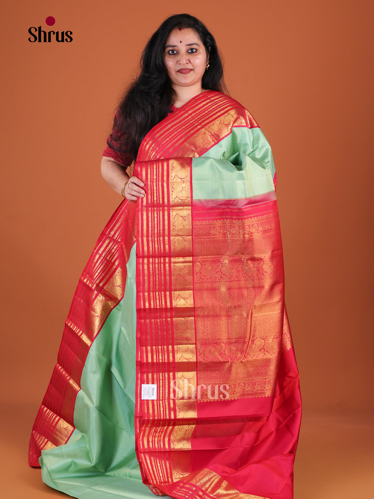 Luminous Pista Green Kanchipuram Silk Saree With Fine Stripes | Red Zari Striped Border & Brocade Pallu