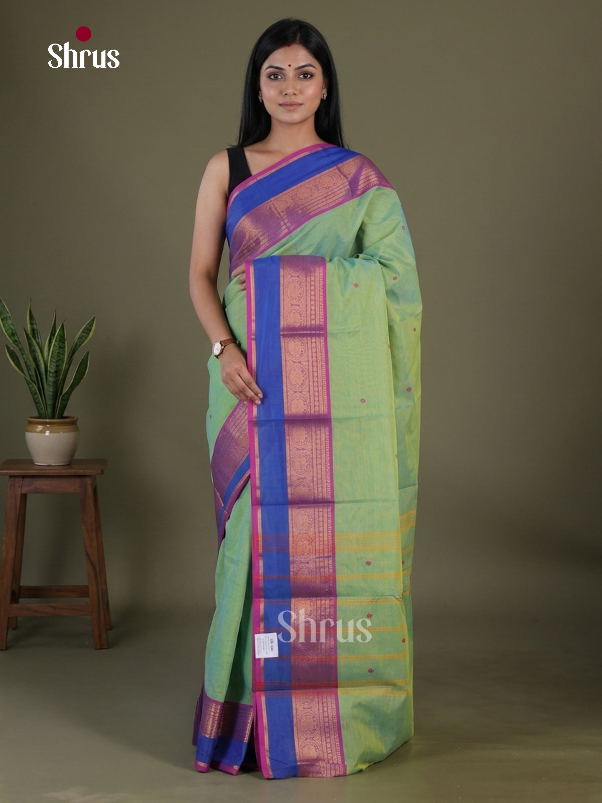 Luxurious Pista Green Chettinad Cotton Saree With Floral Buttas & Magenta Zari Border