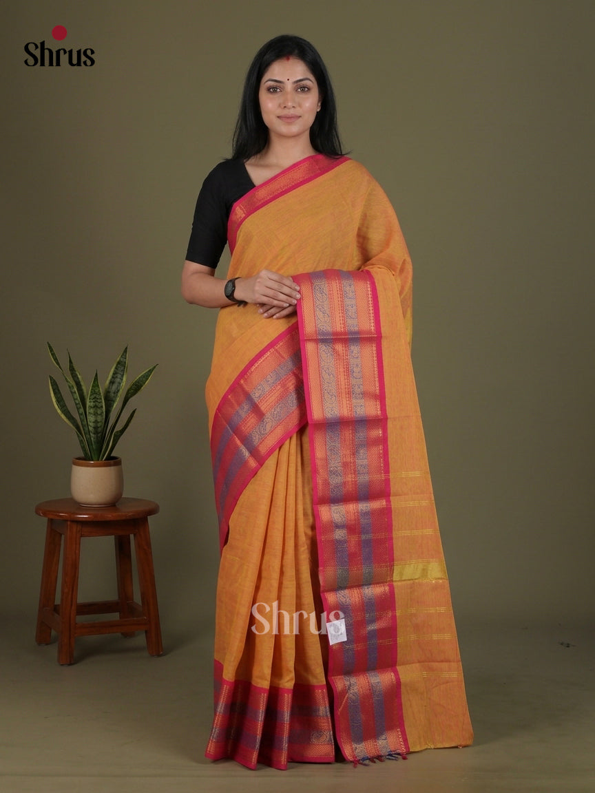 Opulent Soft Orange Chettinad Cotton Saree With Pink Zari Woven Broad Border