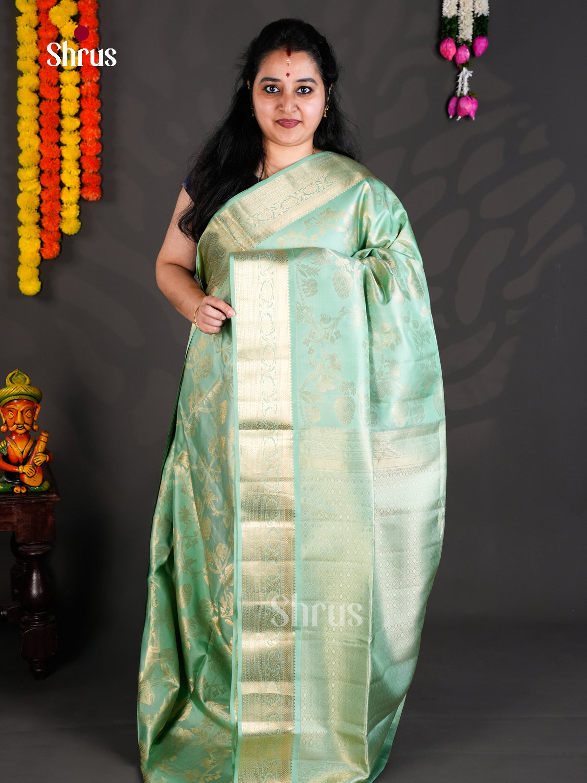 Buy Charming Pista Green Soft Silk Saree with Floral Nestling Brocade & Zari Border