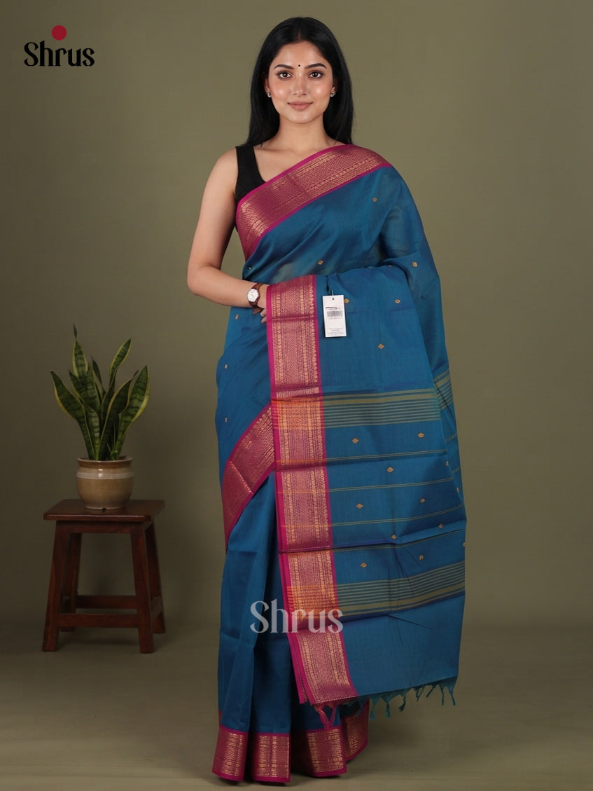 Ravishing Teal Blue Chettinad Cotton Saree With Thread Buttas & Magenta Zari Border