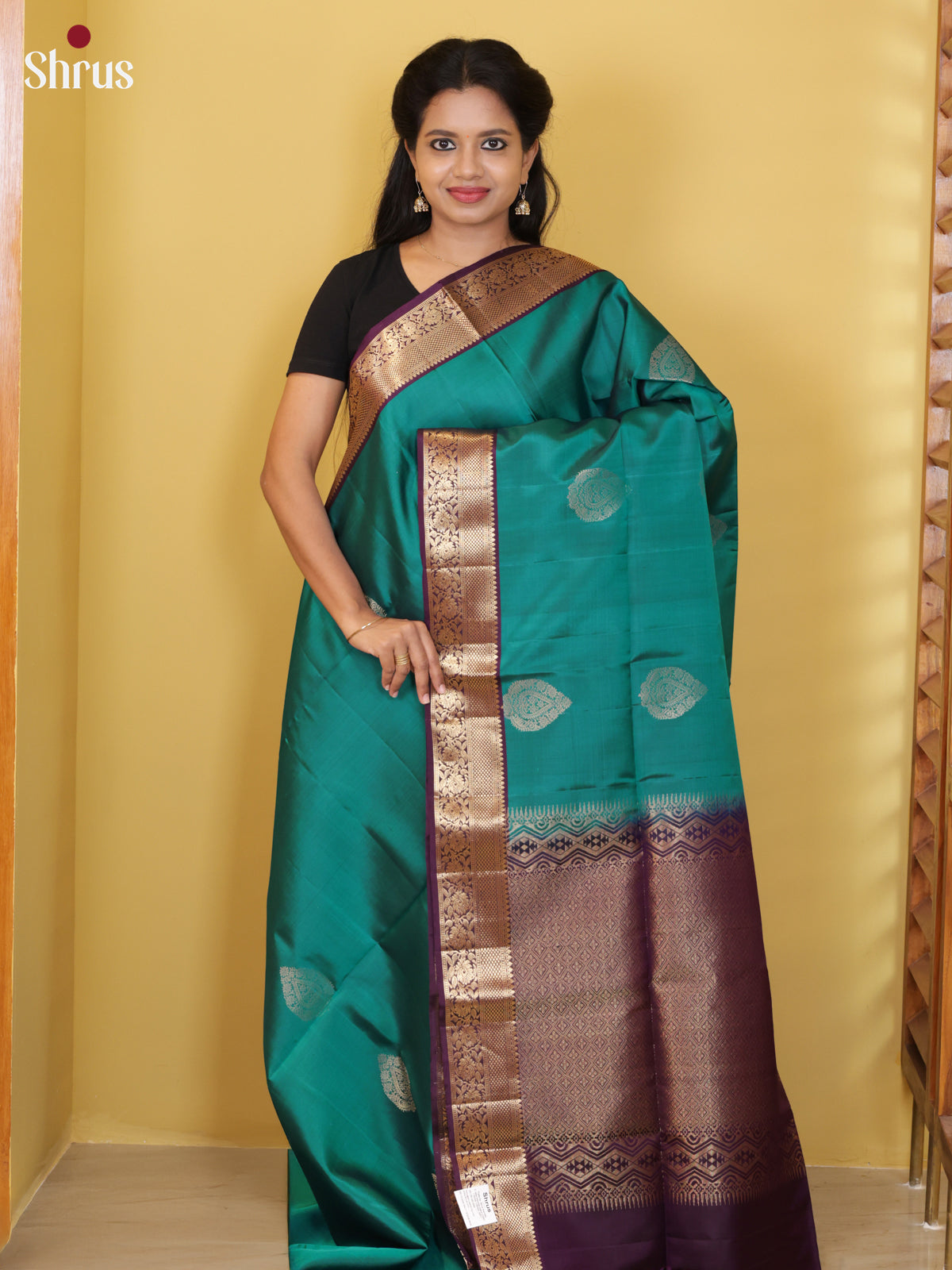 Buy Glimmering Sea Green Soft Silk Saree With Paisley Motifs & Purple Zari Border & Pallu