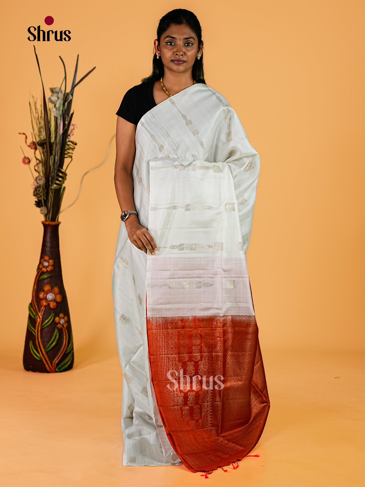 Serene White Soft Silk Sarees with Twin Bird Golden Buttas & Rust Orange Zari Woven Pallu