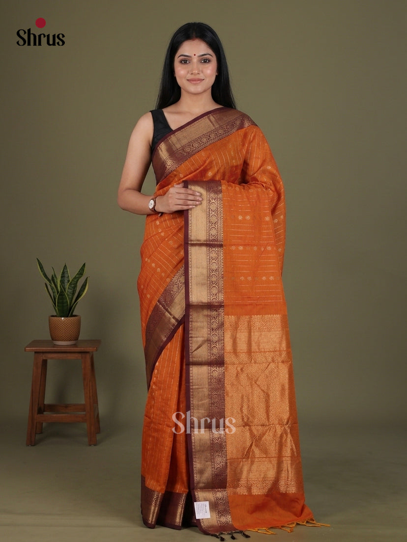 Shimmery Orange Chettinad Cotton Saree With Golden Stripes, Floral Buttas & Brocade Pallu
