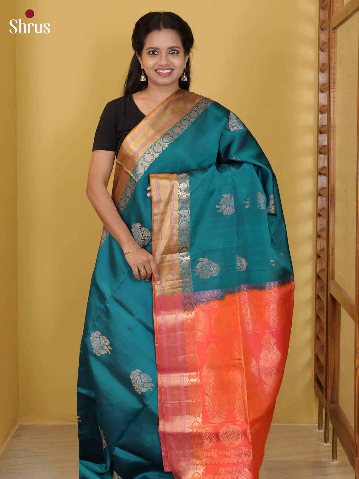 Buy Exquisite Teal Soft Silk Saree with Floral Motifs, Zari Border & Orangish Pink Pallu