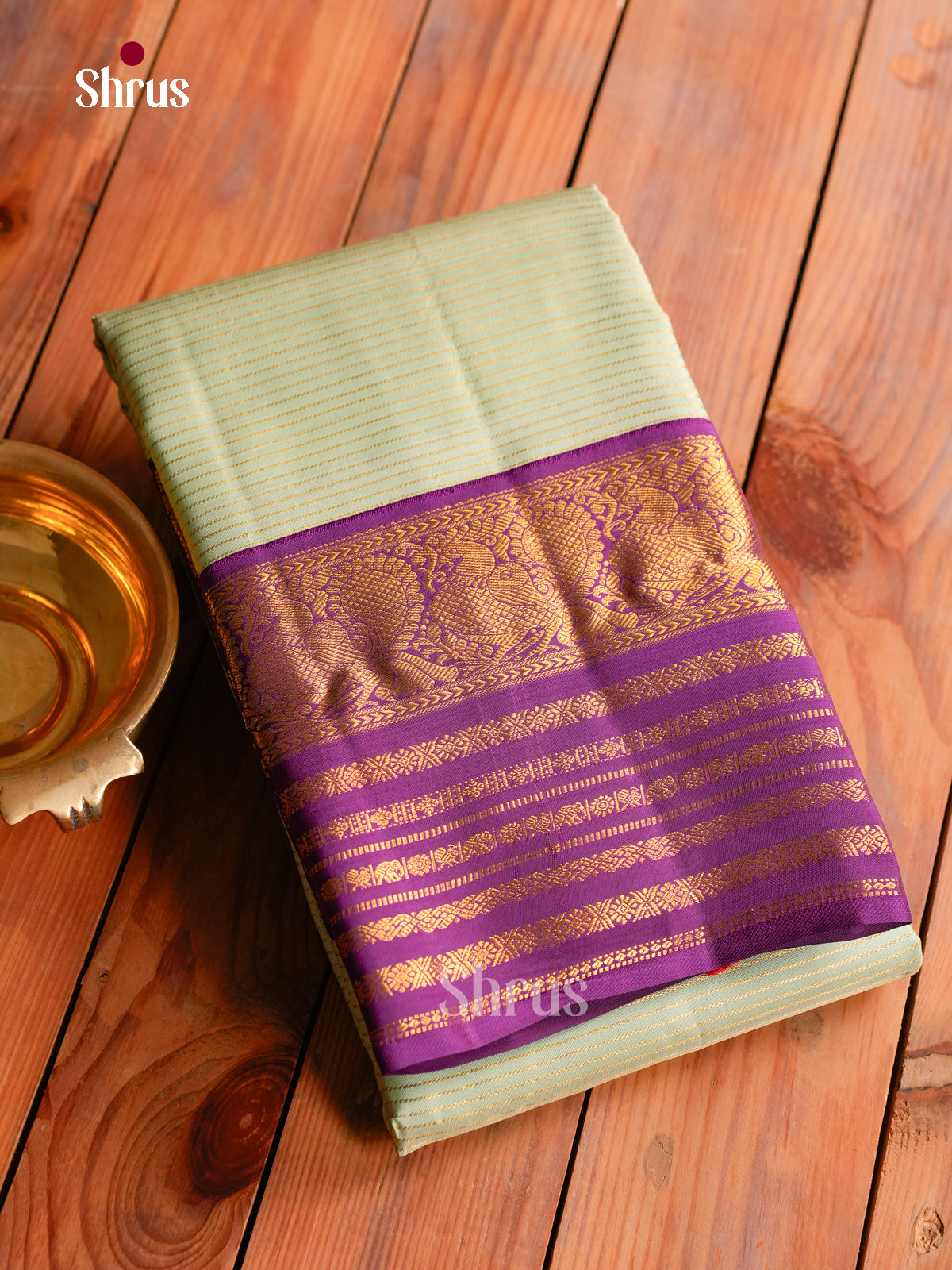 Timeless Pastel Green Kanchipuram Silk Saree With Gold Stripes | Purple Border With Zari Bands