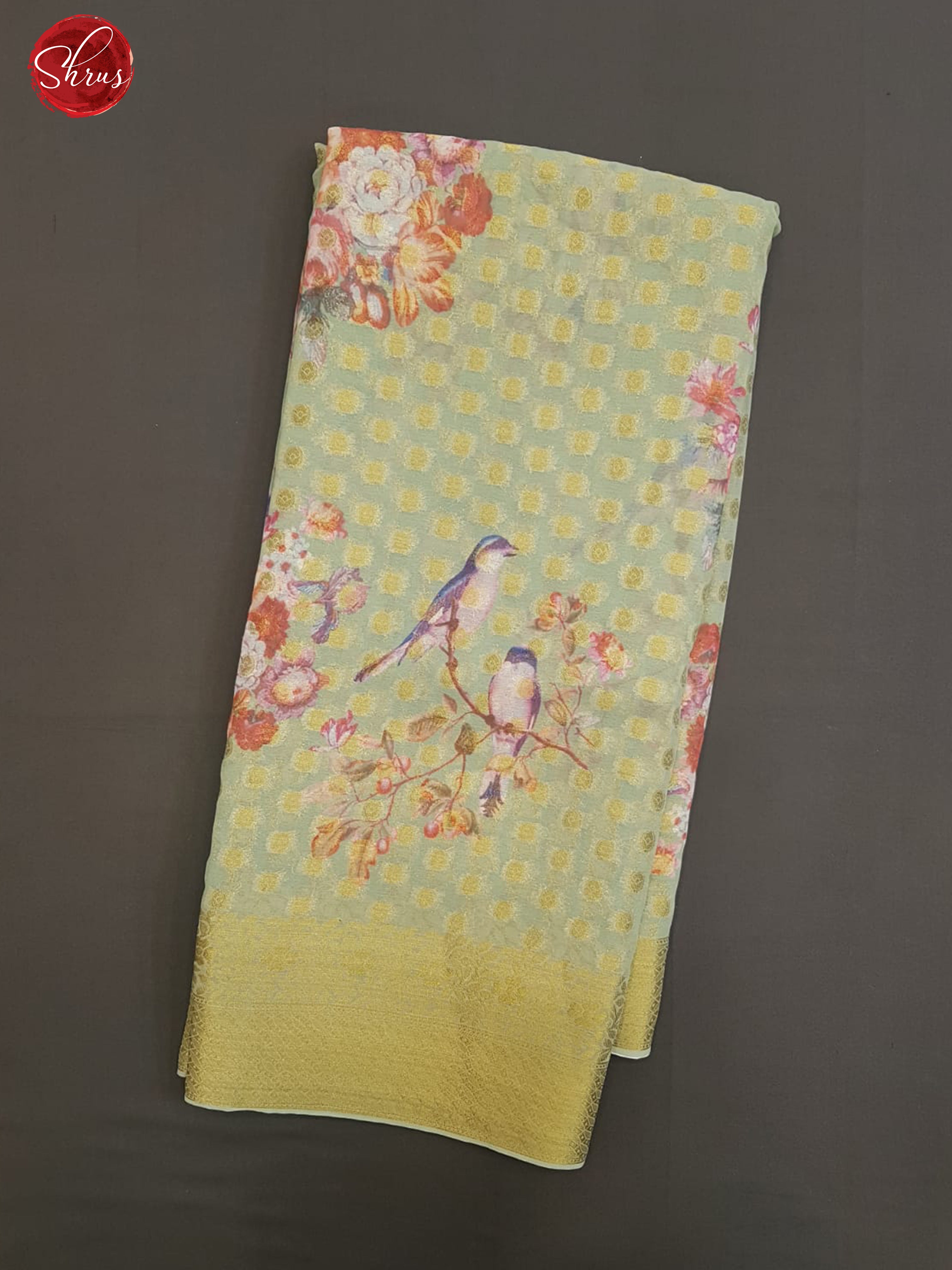 Pista Green(Single tone)- Semi Chiffon with zari floral buttas , floral print on the body & Zari Border - Shop on ShrusEternity.com