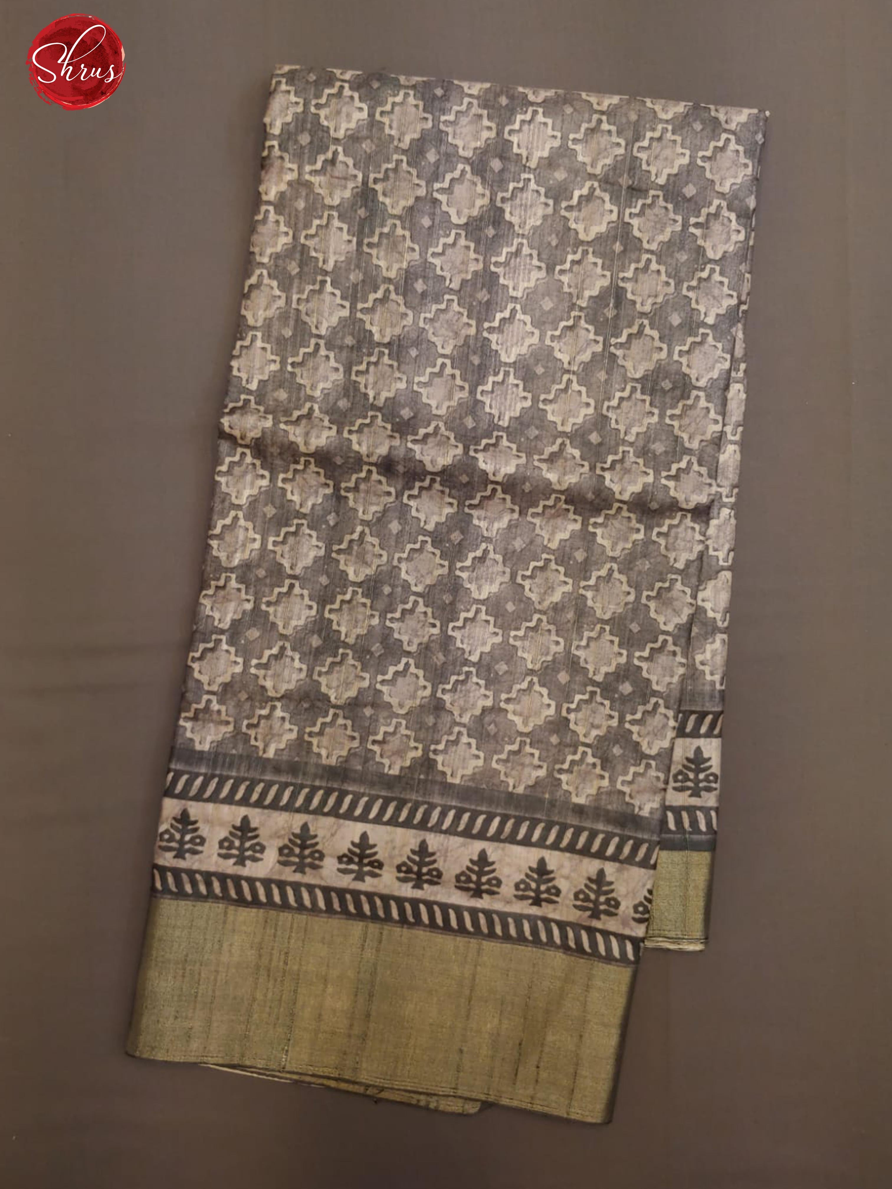 Grey (Single Tone)-Semi Tussar with floral print on the body & zari border - Shop on ShrusEternity.com