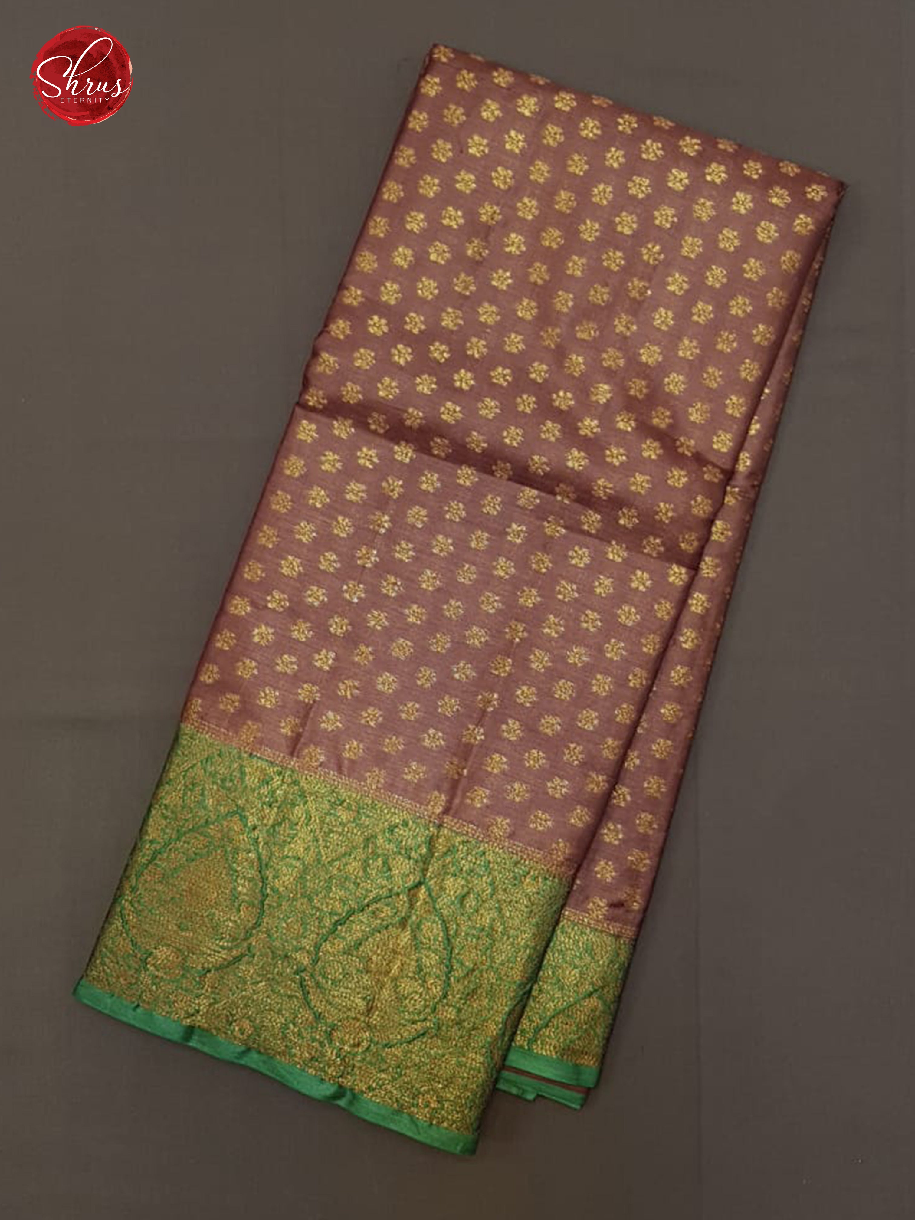 Brown & Green - Tussar with zari woven floral Buttas on the body & contrast Zari Border
