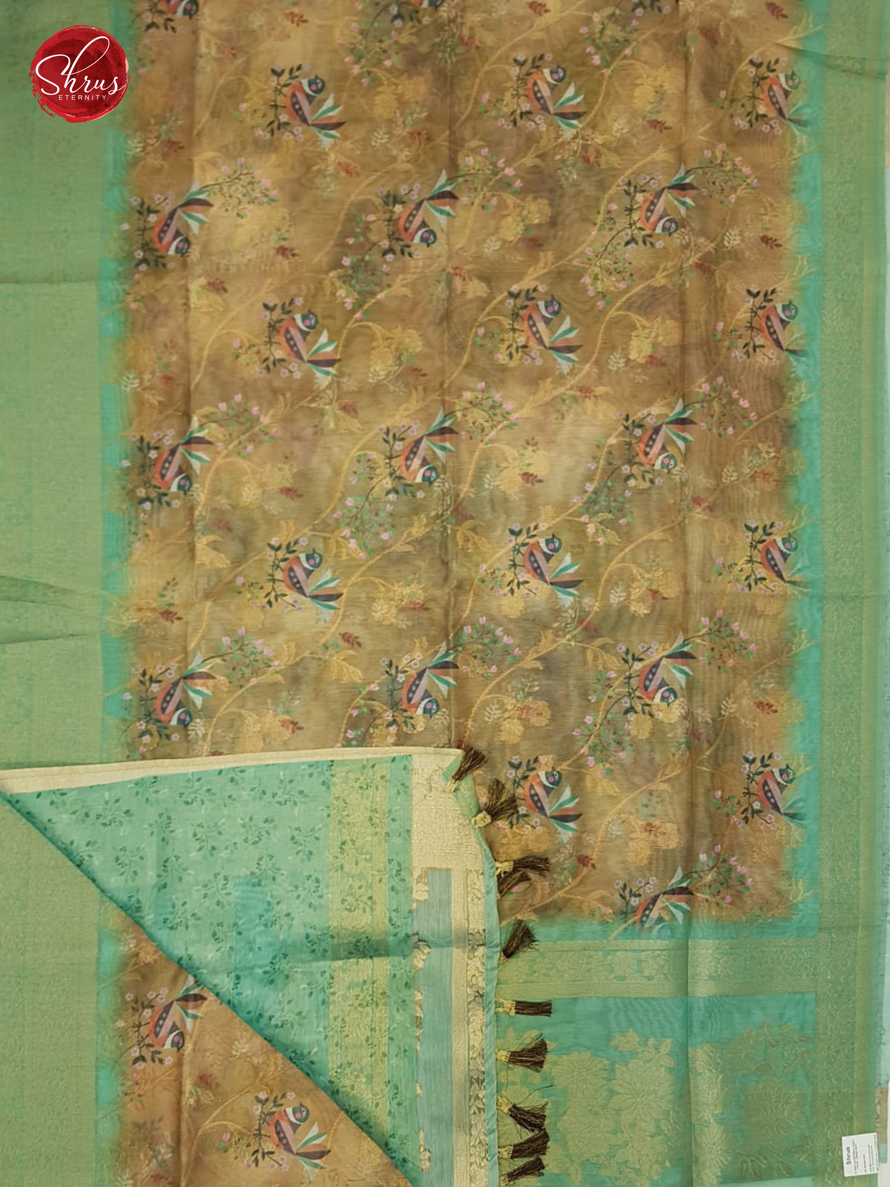 Brown & Green - Semi Jute with floral Print , zari floral nestling on the Body & zari Border - Shop on ShrusEternity.com