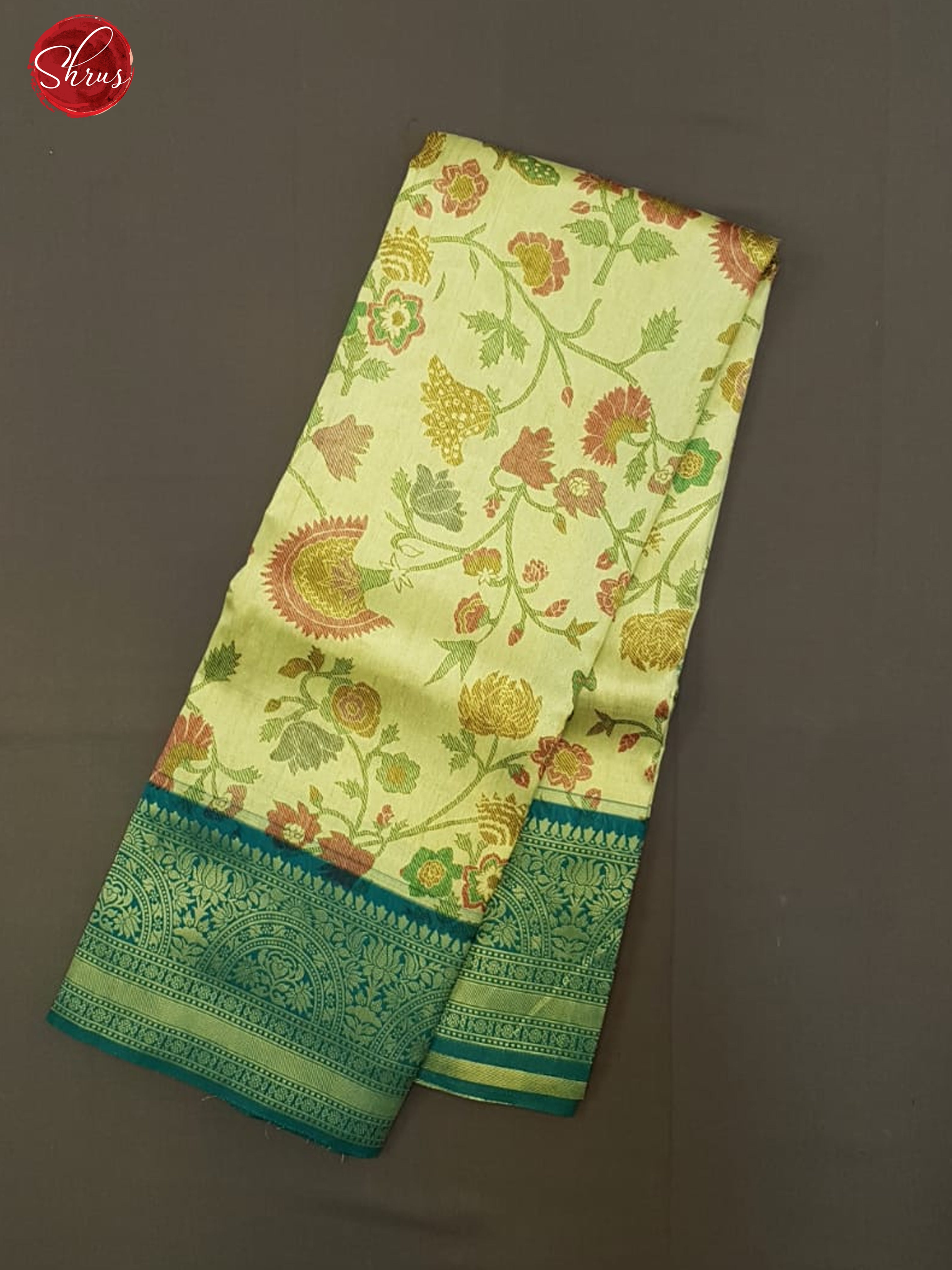 Beige & Green - Semi Kanchipuram Silk with thread woven floral nestling on the body & contrast zari border - Shop on ShrusEternity.com